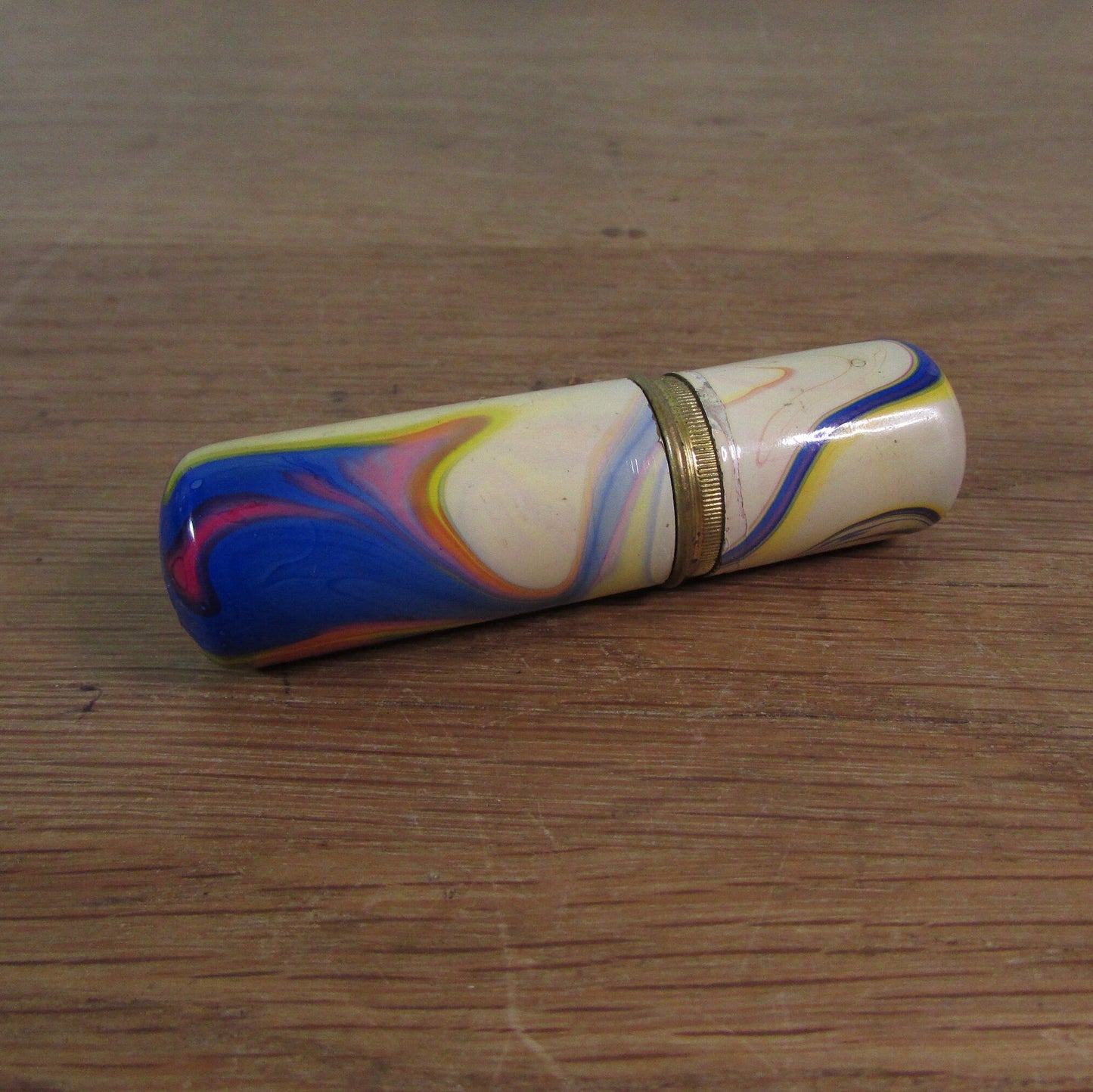 Art Deco marbled brass etui case containing wooden needle holder/thread spool