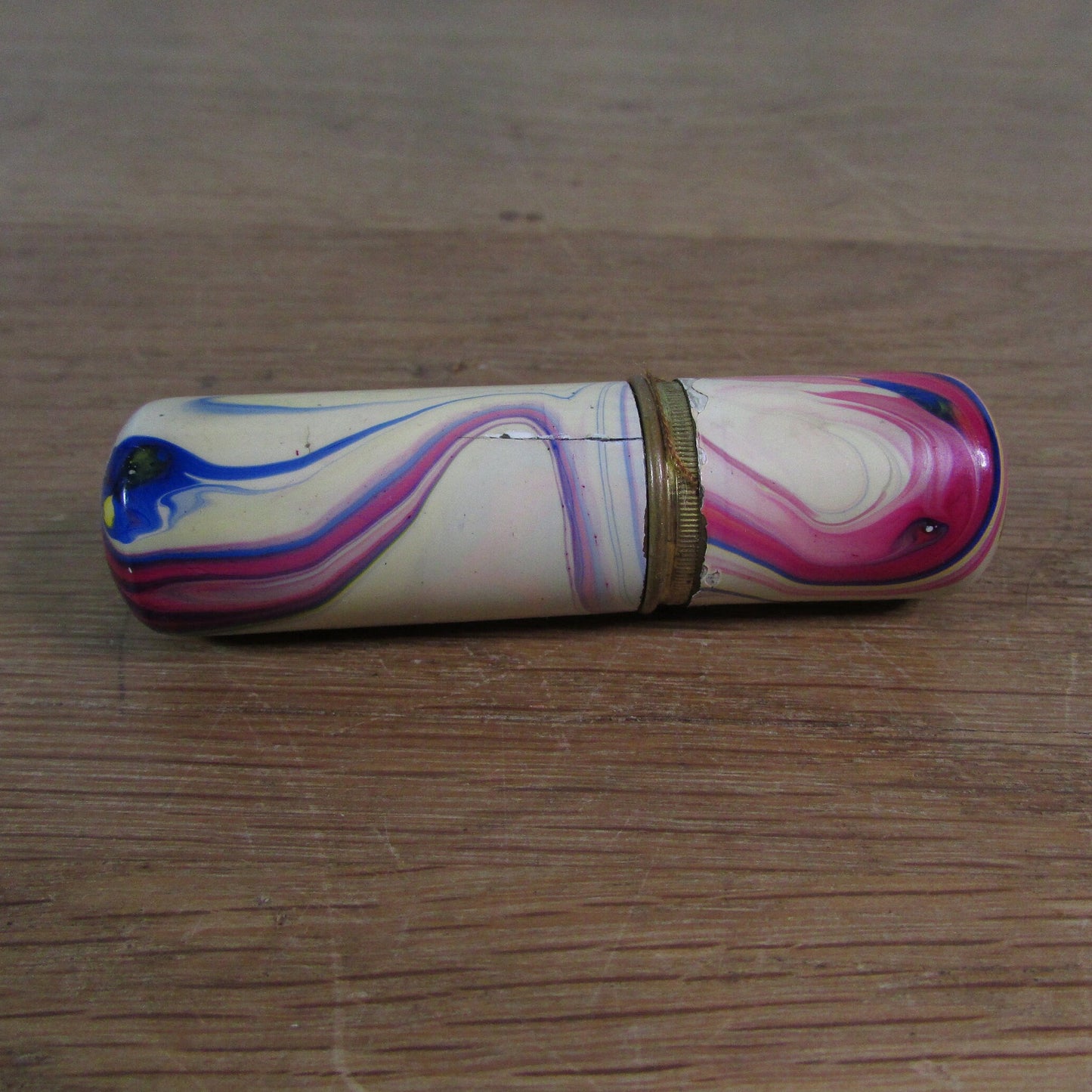 Art Deco marbled brass etui case containing wooden needle holder/thread spool