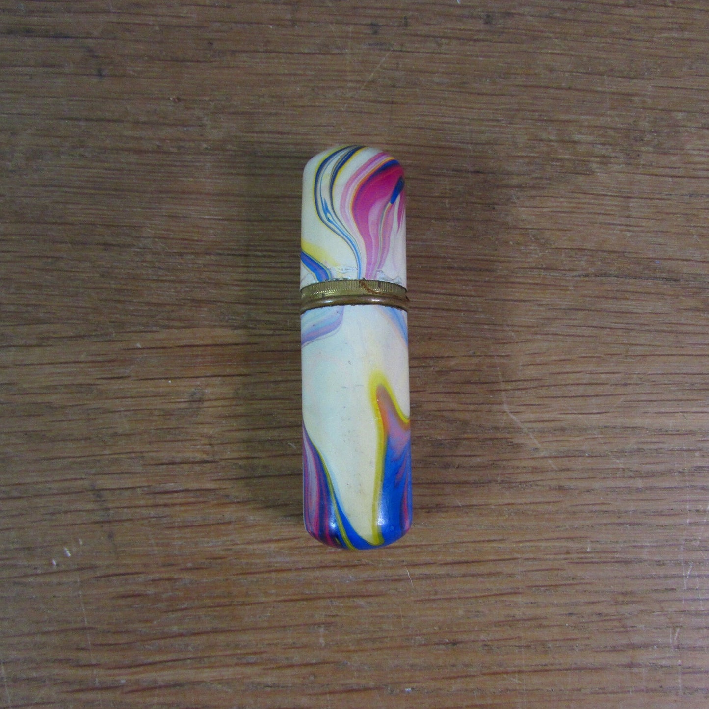 Art Deco marbled brass etui case containing wooden needle holder/thread spool