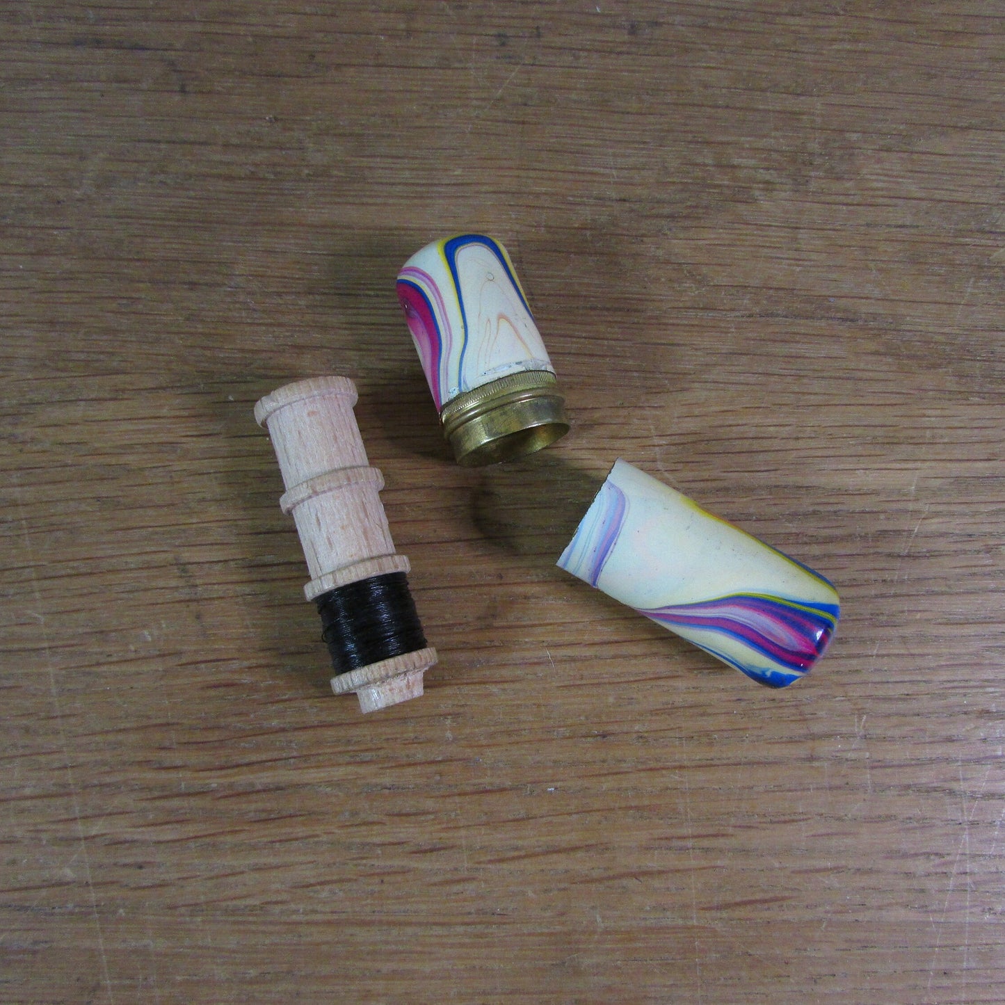 Art Deco marbled brass etui case containing wooden needle holder/thread spool