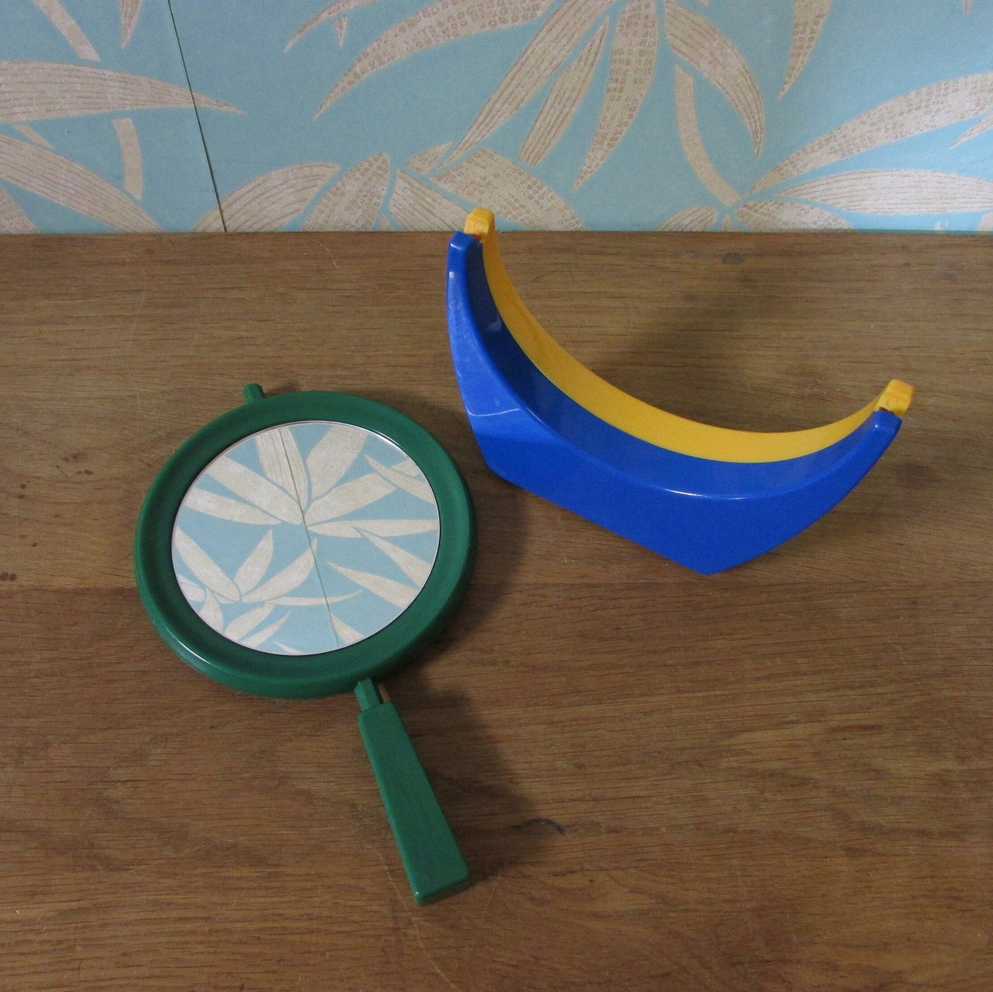 1980s plastic green/blue/yellow handmirror with stand