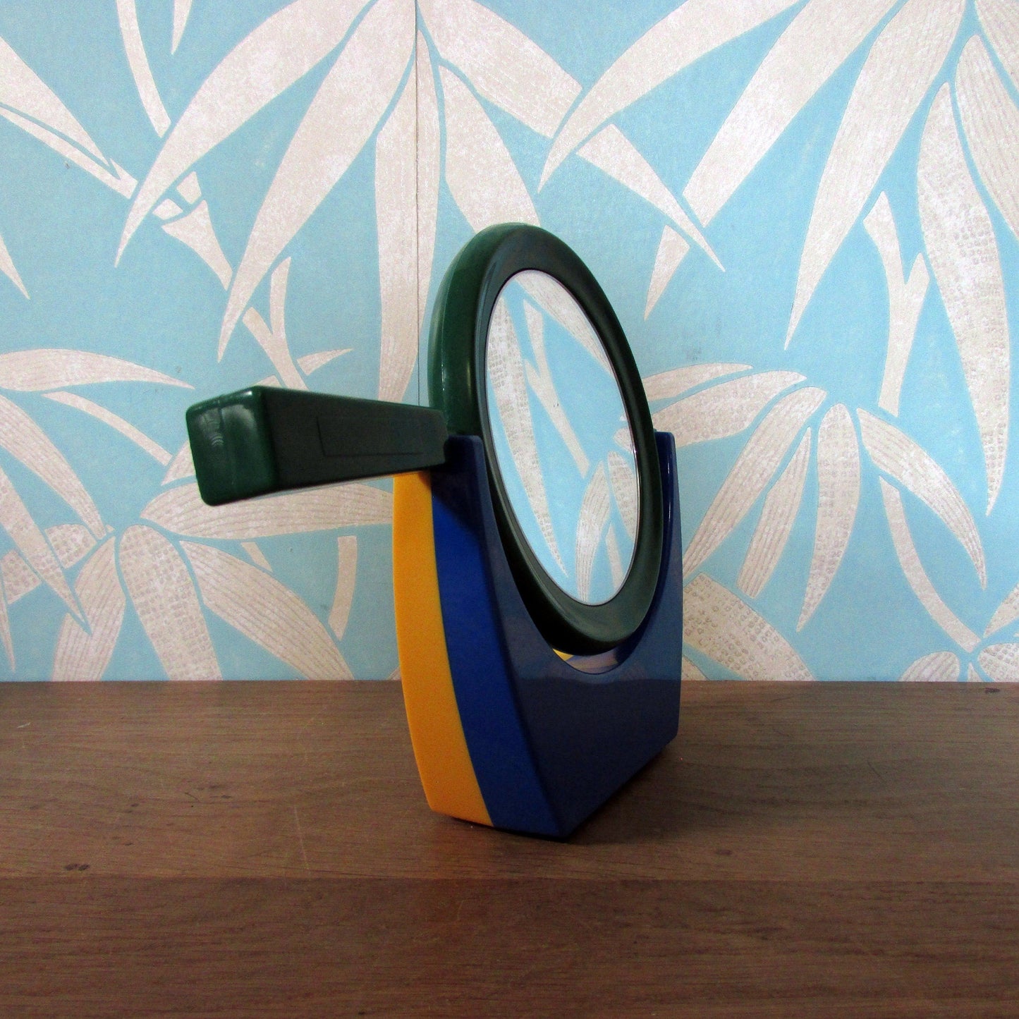 1980s plastic green/blue/yellow handmirror with stand