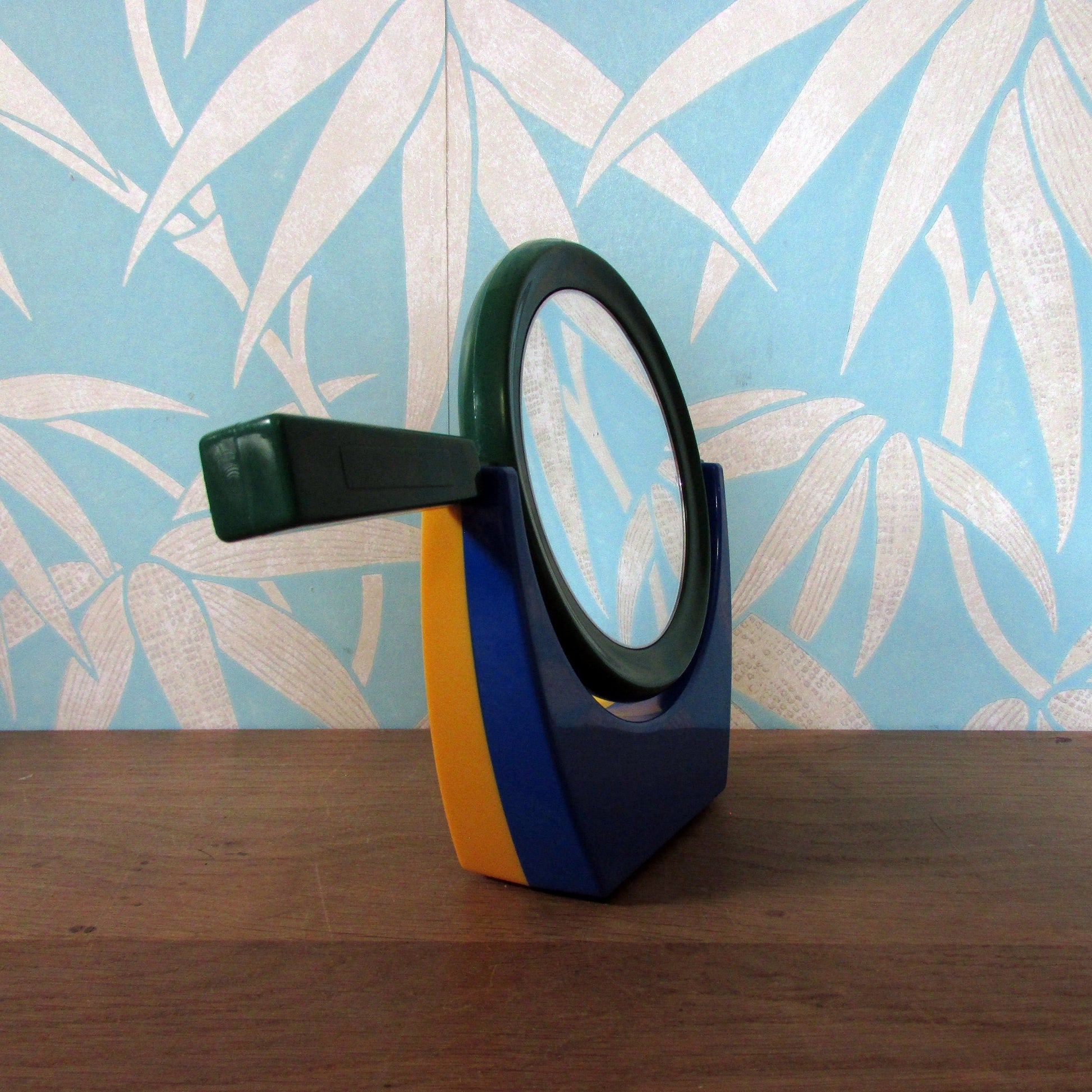 1980s plastic green/blue/yellow handmirror with stand