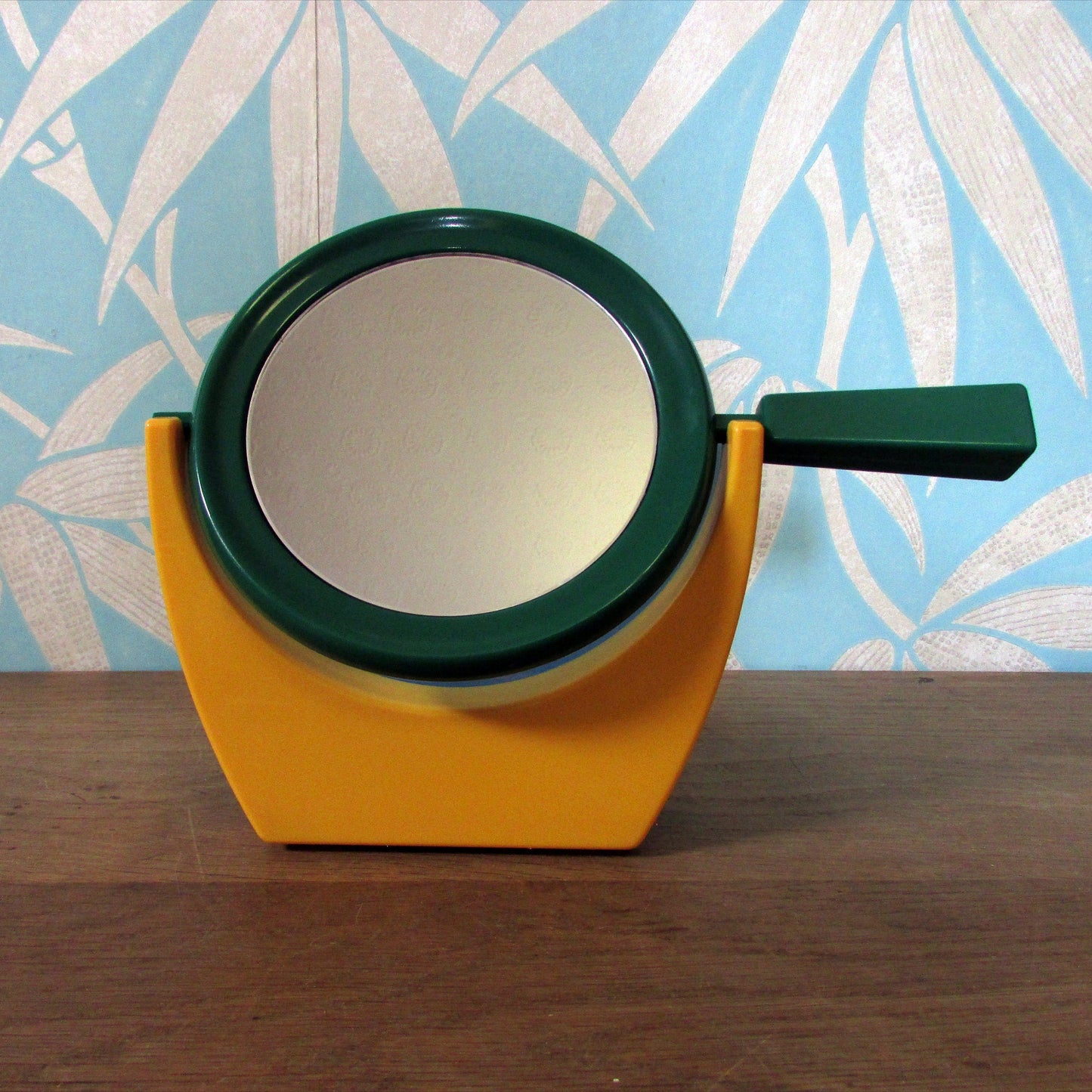 1980s plastic green/blue/yellow handmirror with stand