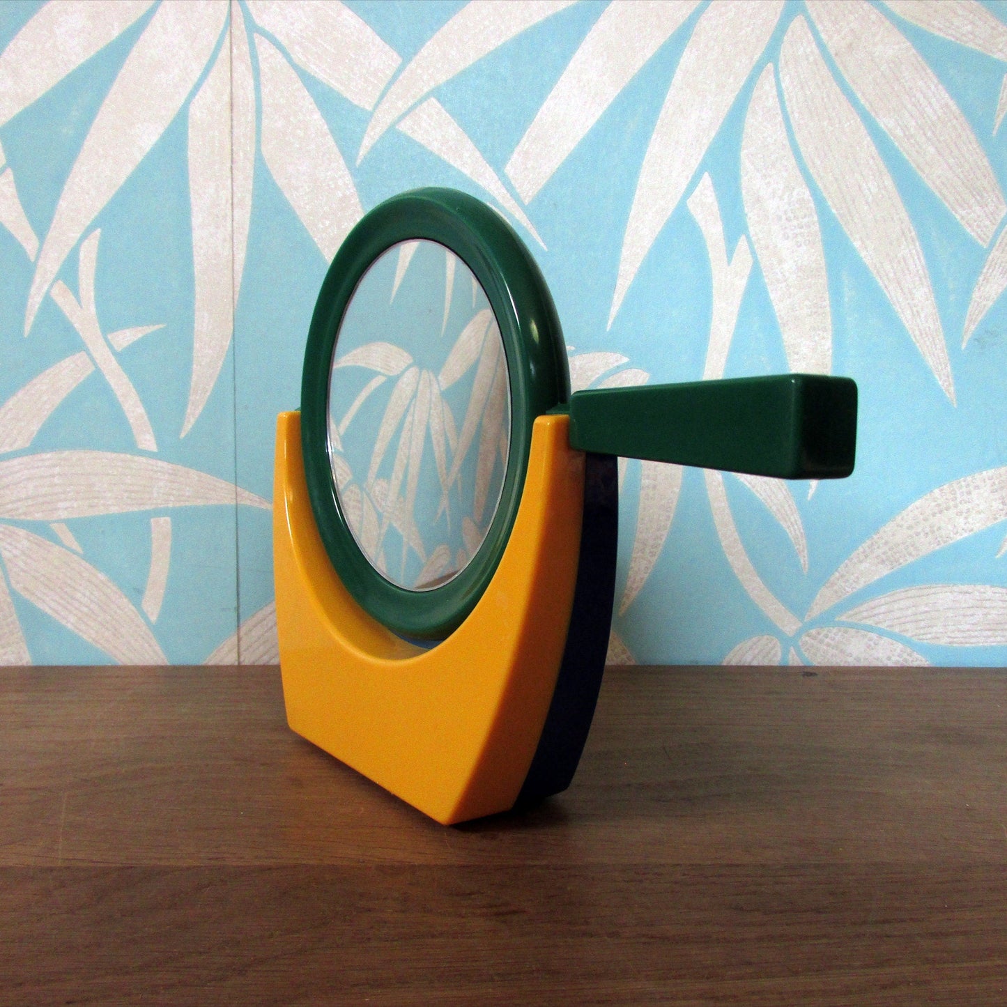 1980s plastic green/blue/yellow handmirror with stand
