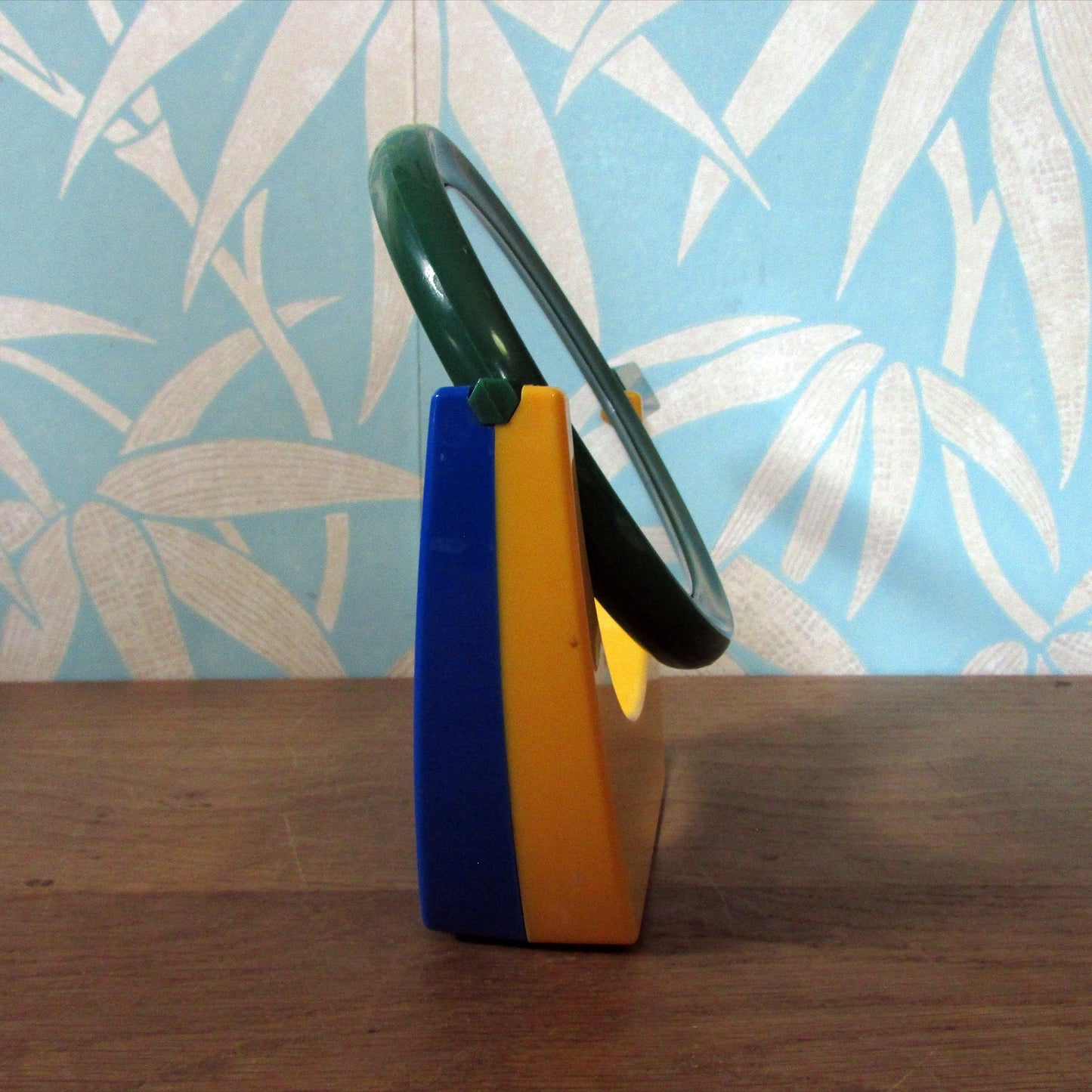 1980s plastic green/blue/yellow handmirror with stand