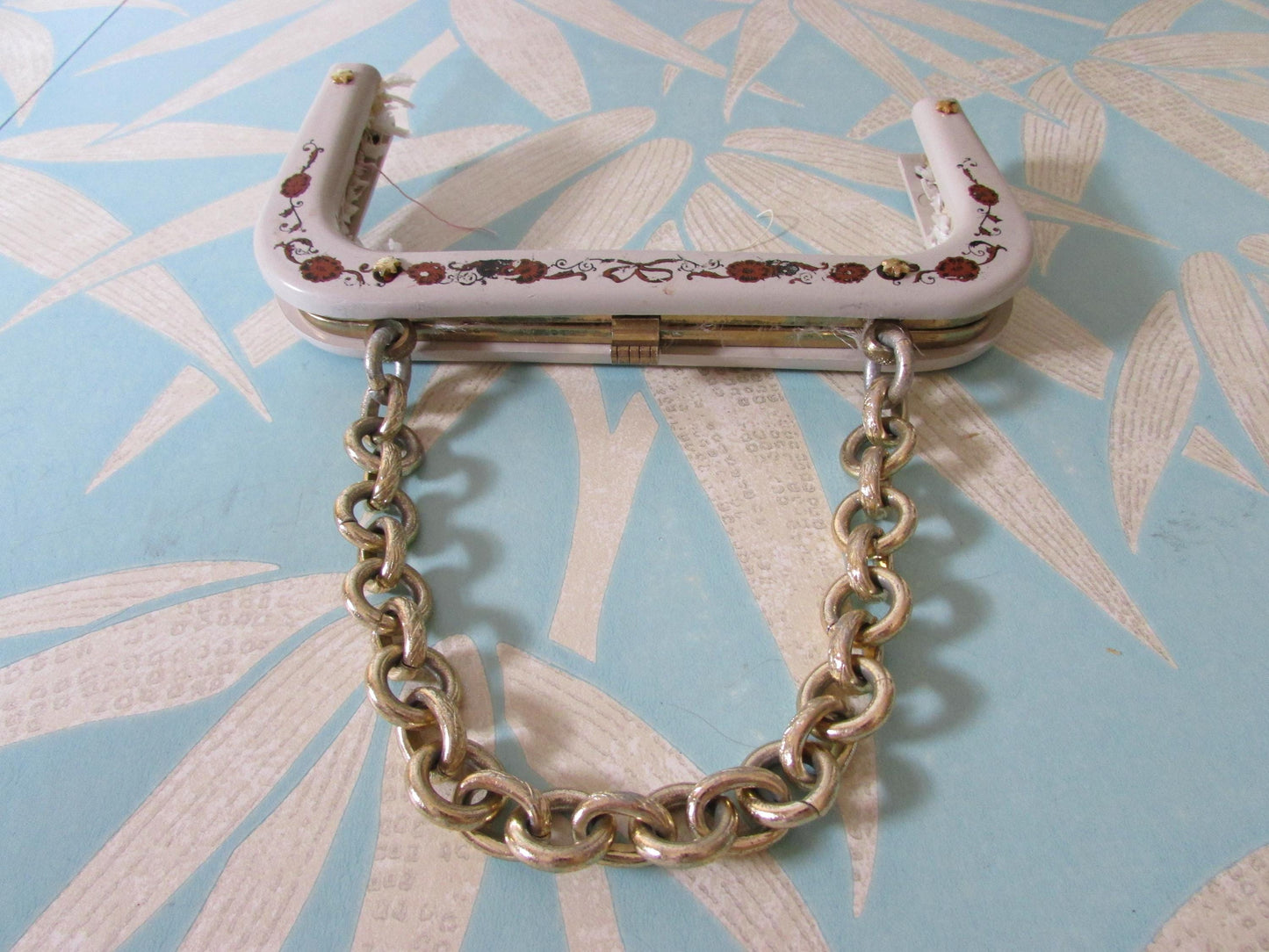 Vintage white plastic handbag/purse frame with ribbon and flower transfer detail and gold-tone chain