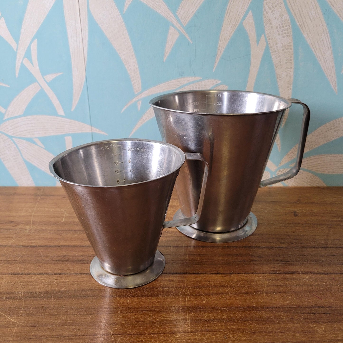 Pair of vintage Rostfritt Stal Sweden stainless steel measuring jugs
