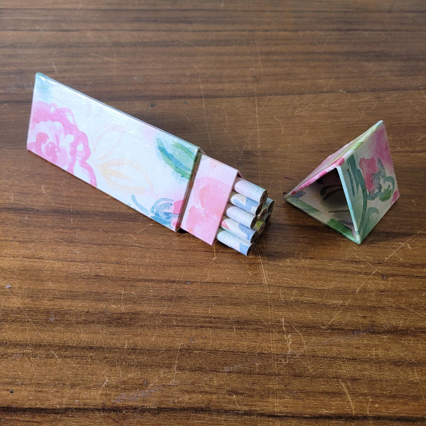 1980s Two's Company triangular floral print box containing 18 unused graphite pencils