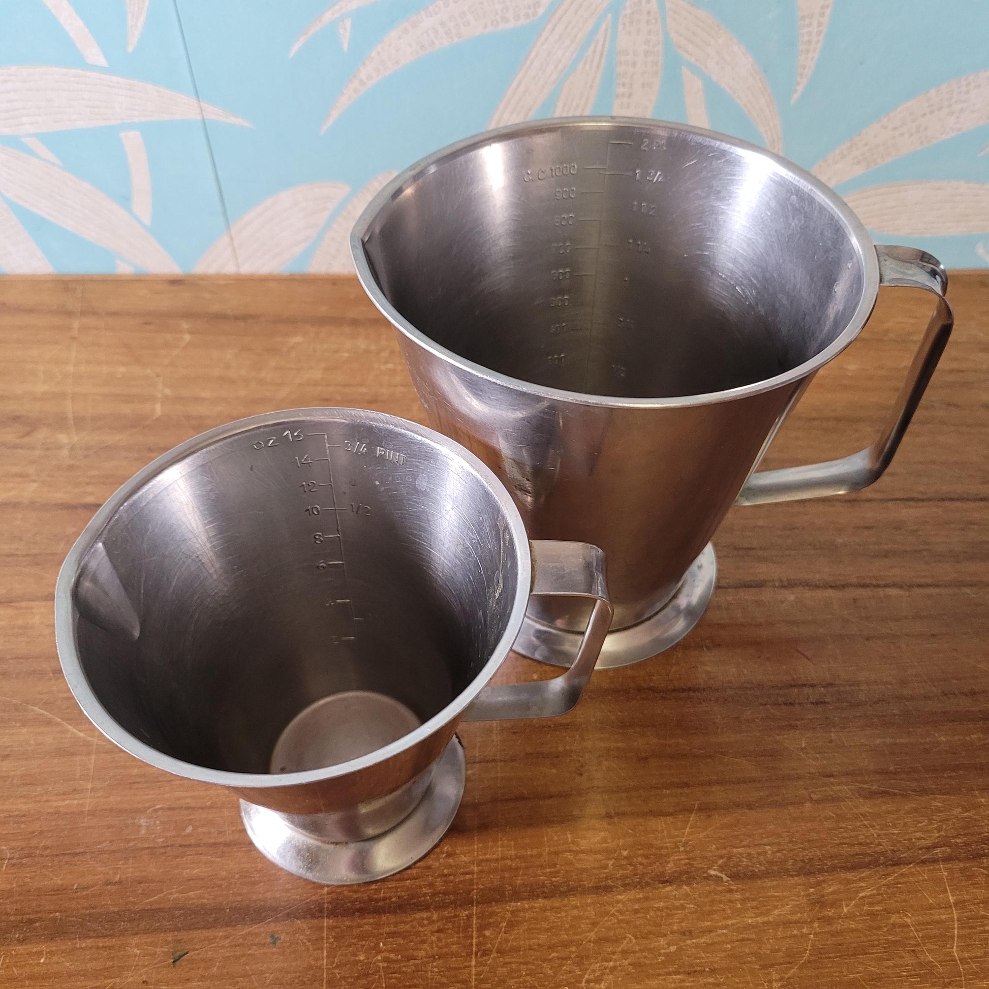 Pair of vintage Rostfritt Stal Sweden stainless steel measuring jugs