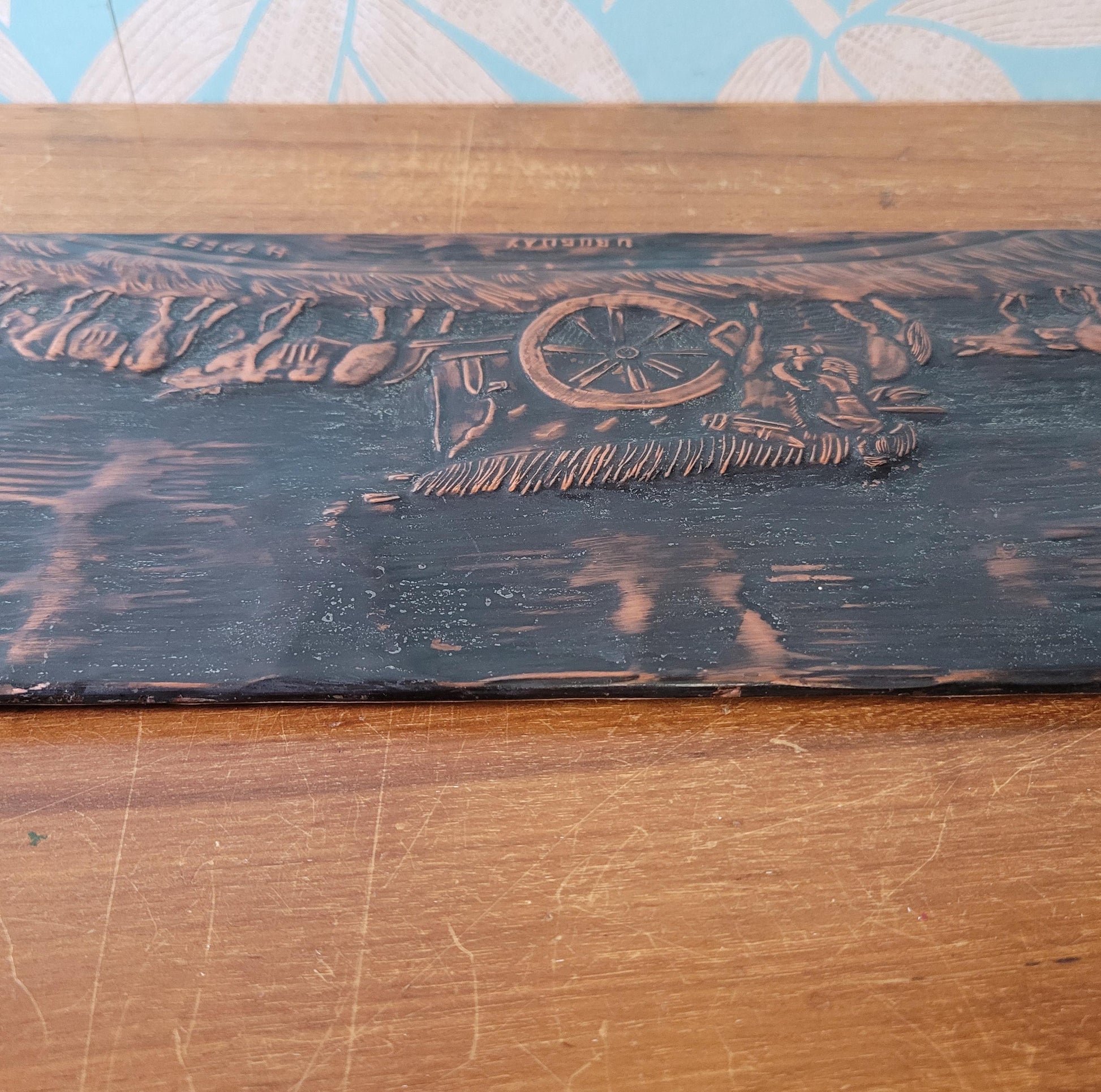 Vintage hammered copper plaque depicting La Carreta, Uruguay, signed by artist