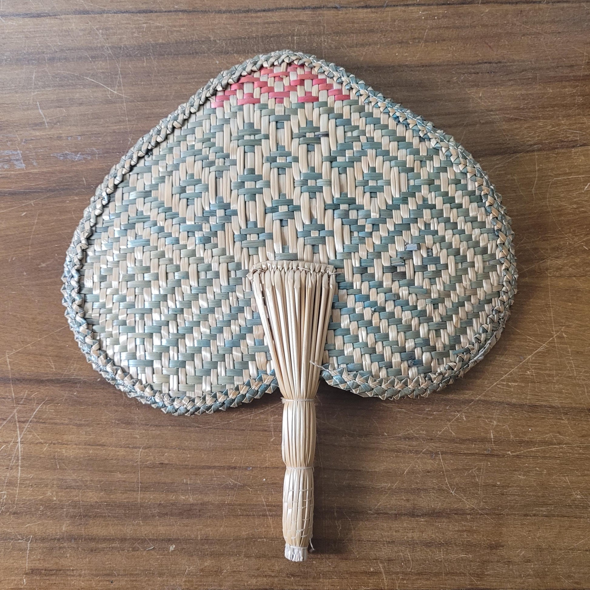 Vintage 1970s-style woven pandanus hand fan