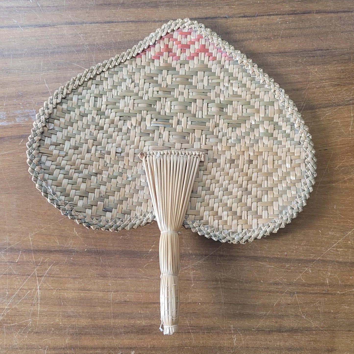 Vintage 1970s-style woven pandanus hand fan