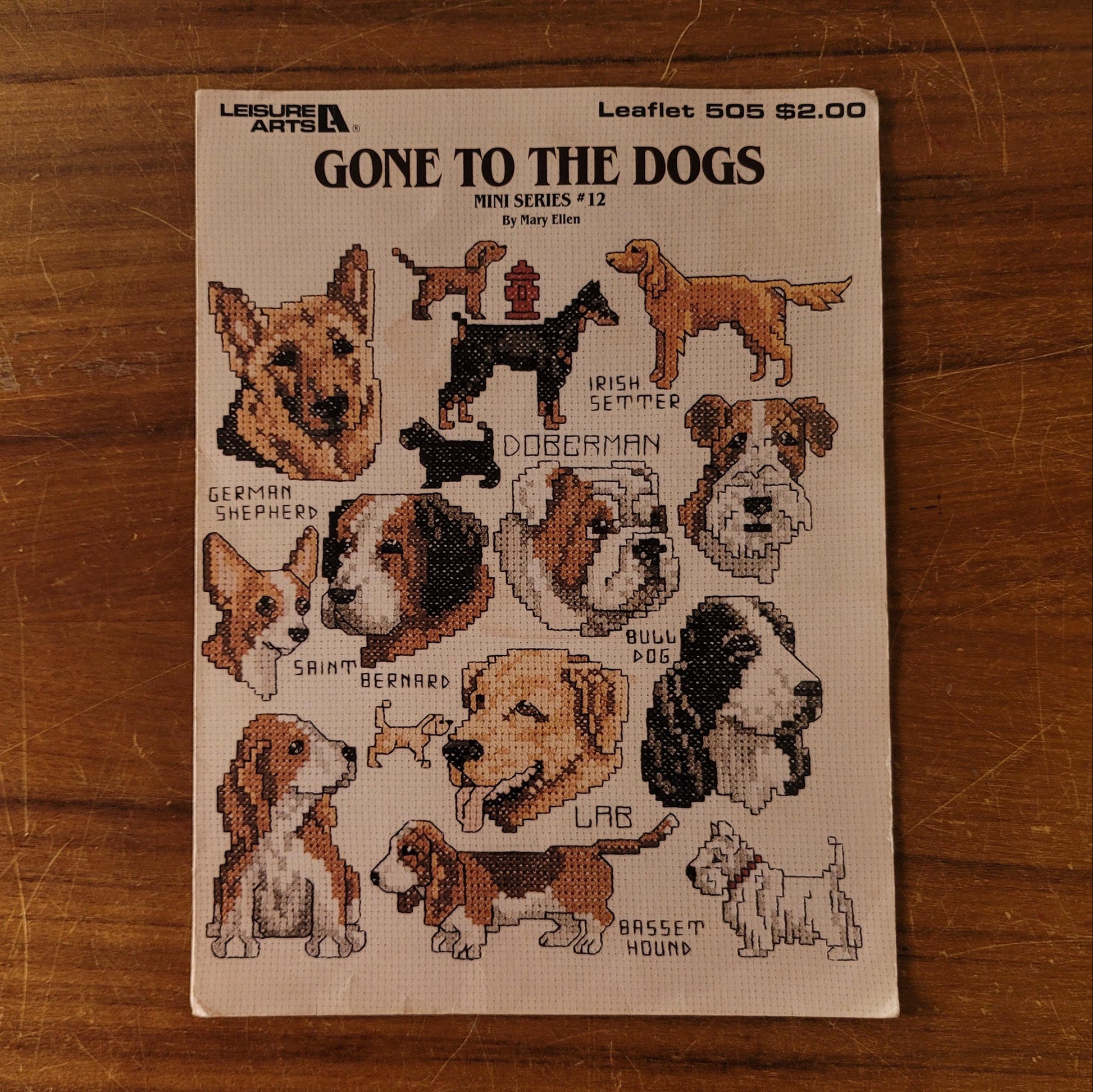 1987 Leisure Arts Craft Leaflet 505 'Gone to the Dogs' cross stitch designs by Mary Ellen