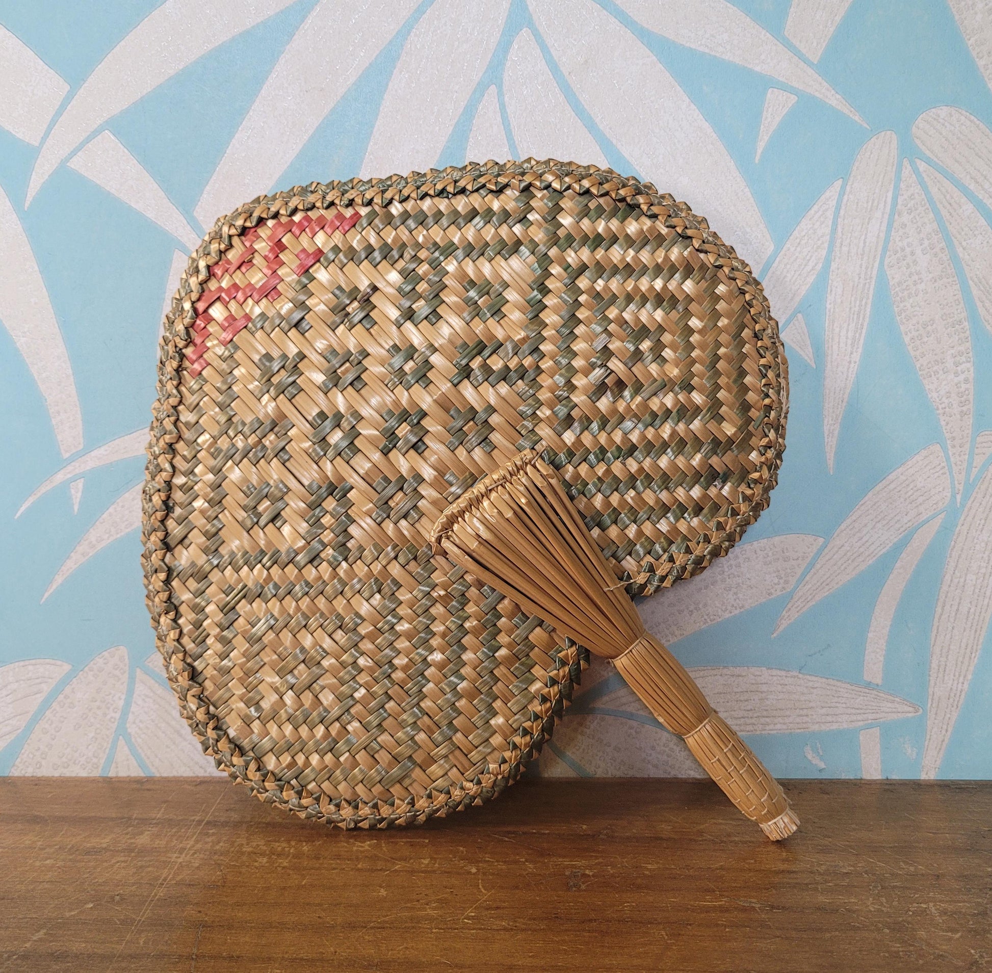 Vintage 1970s-style woven pandanus hand fan