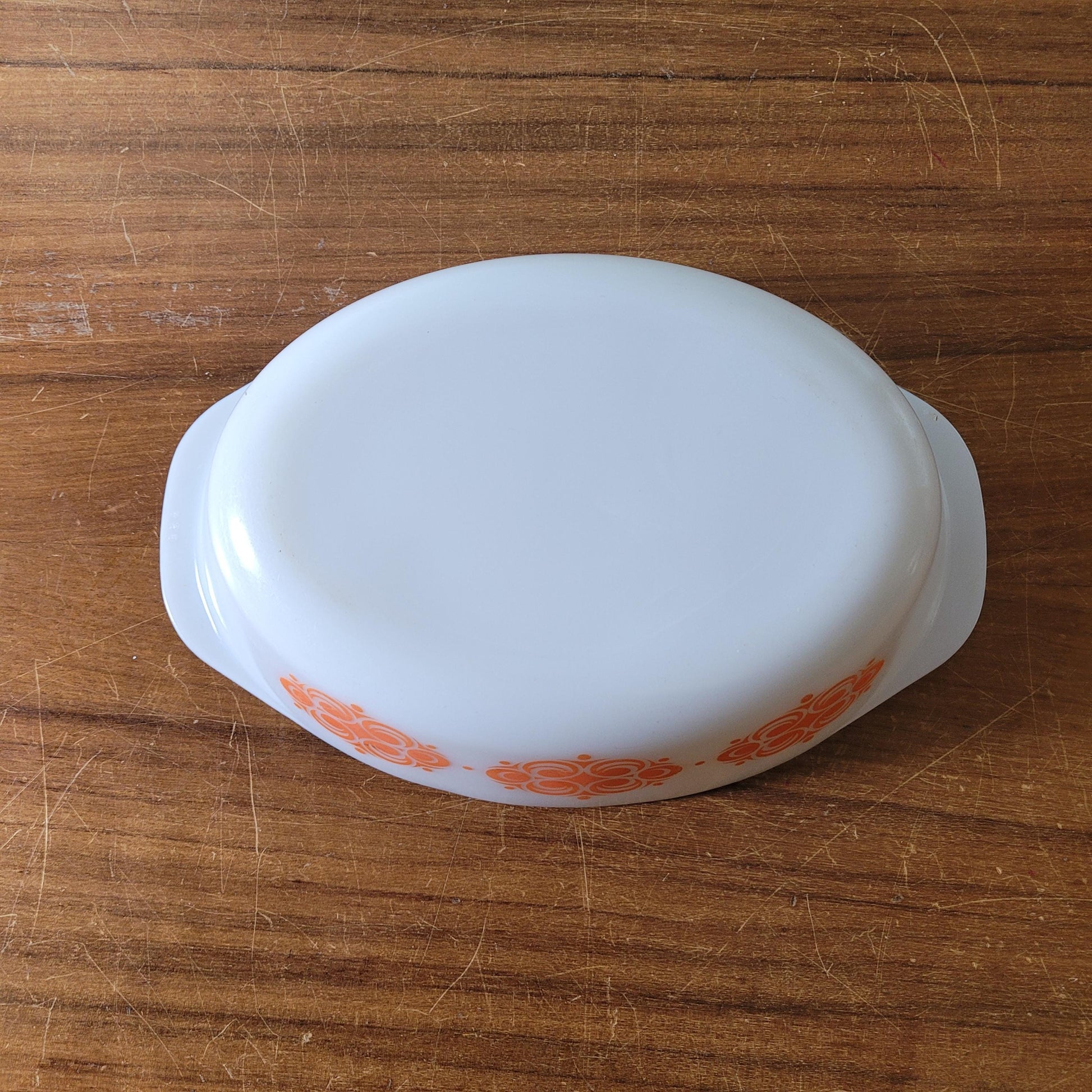 1970s geometric orange pattern Agee Pyrex casserole dish