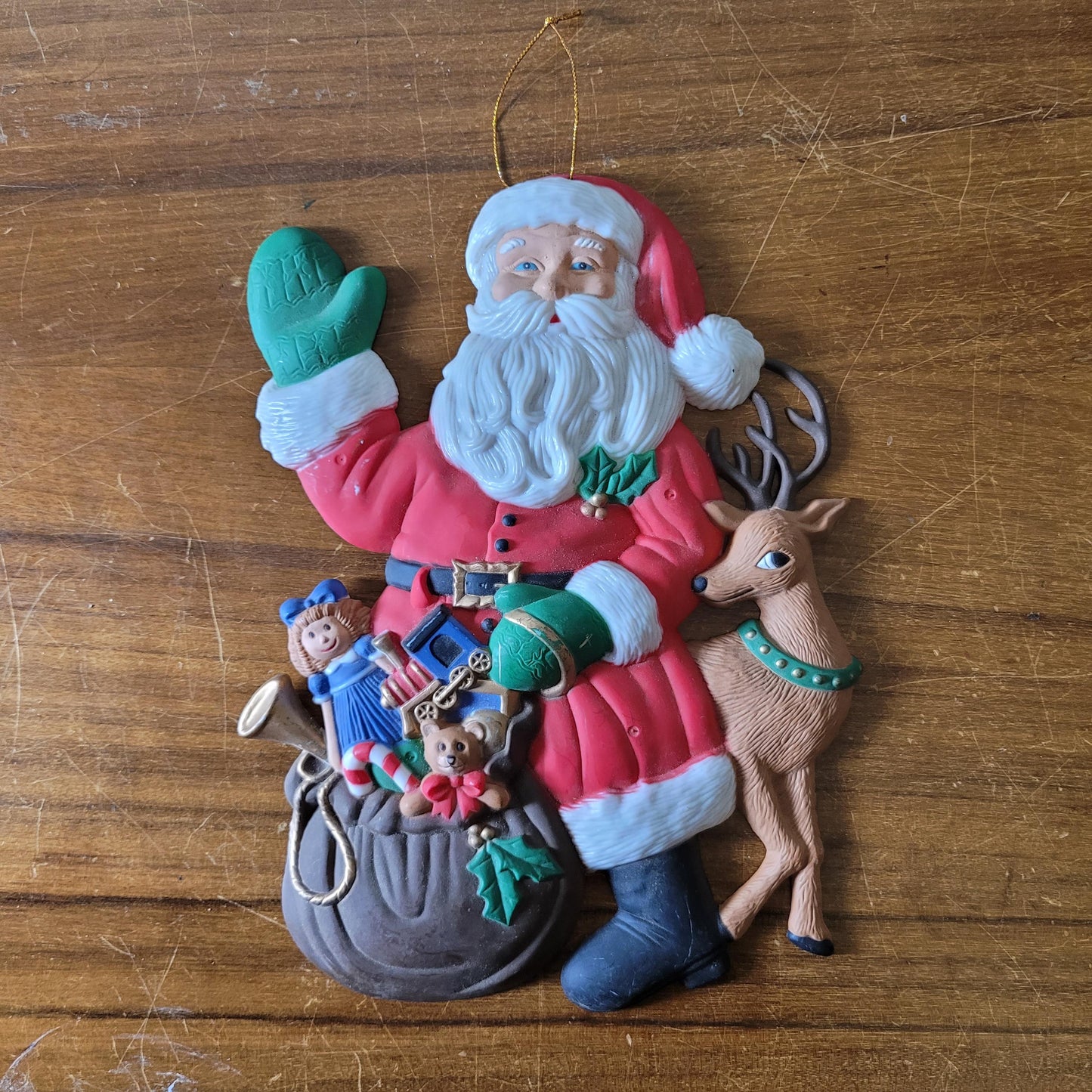 Vintage plastic Santa with toy sack & reindeer wall hanging