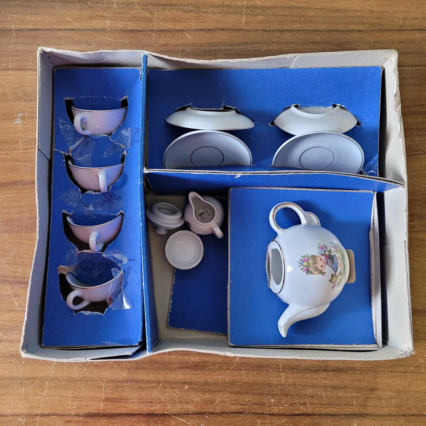 1960s children's china teaset, illustrated with girl and kitten