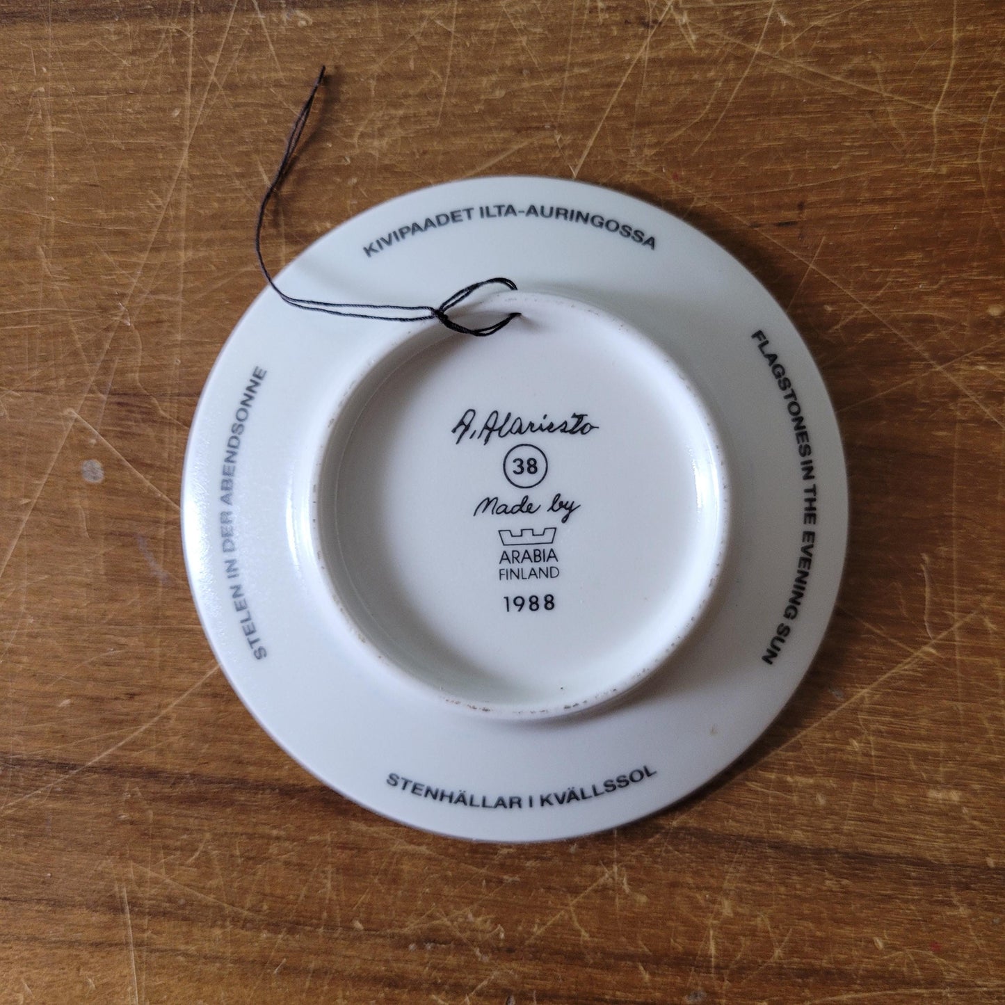 Two 1980s miniature decorative plates by A. Alariesto for Arabia, Finland