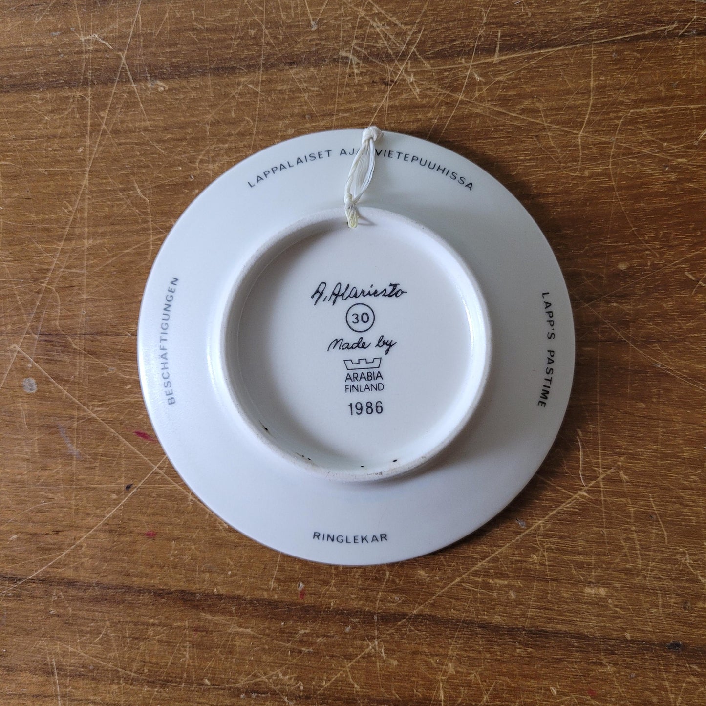 Two 1980s miniature decorative plates by A. Alariesto for Arabia, Finland