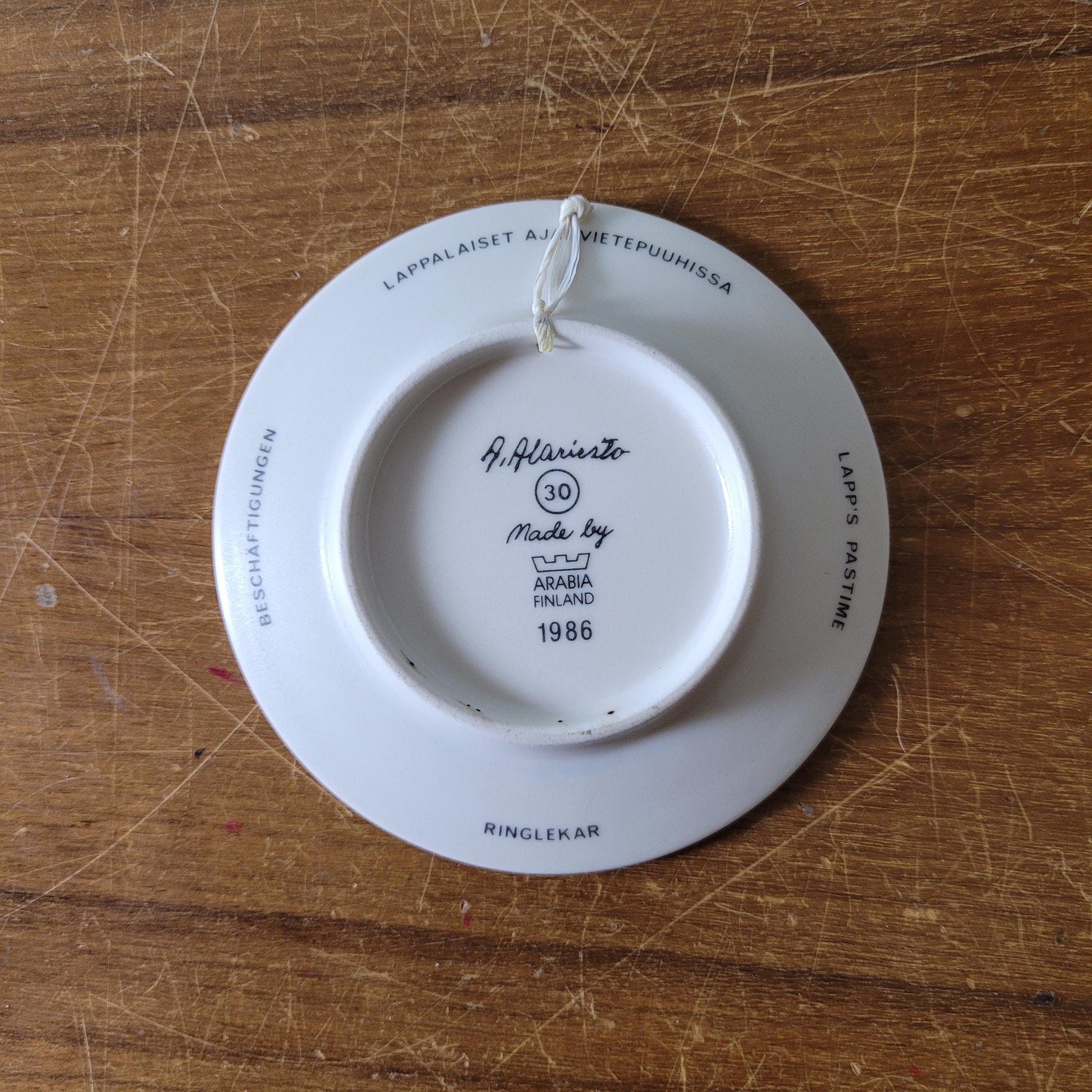 Two 1980s miniature decorative plates by A. Alariesto for Arabia, Finland