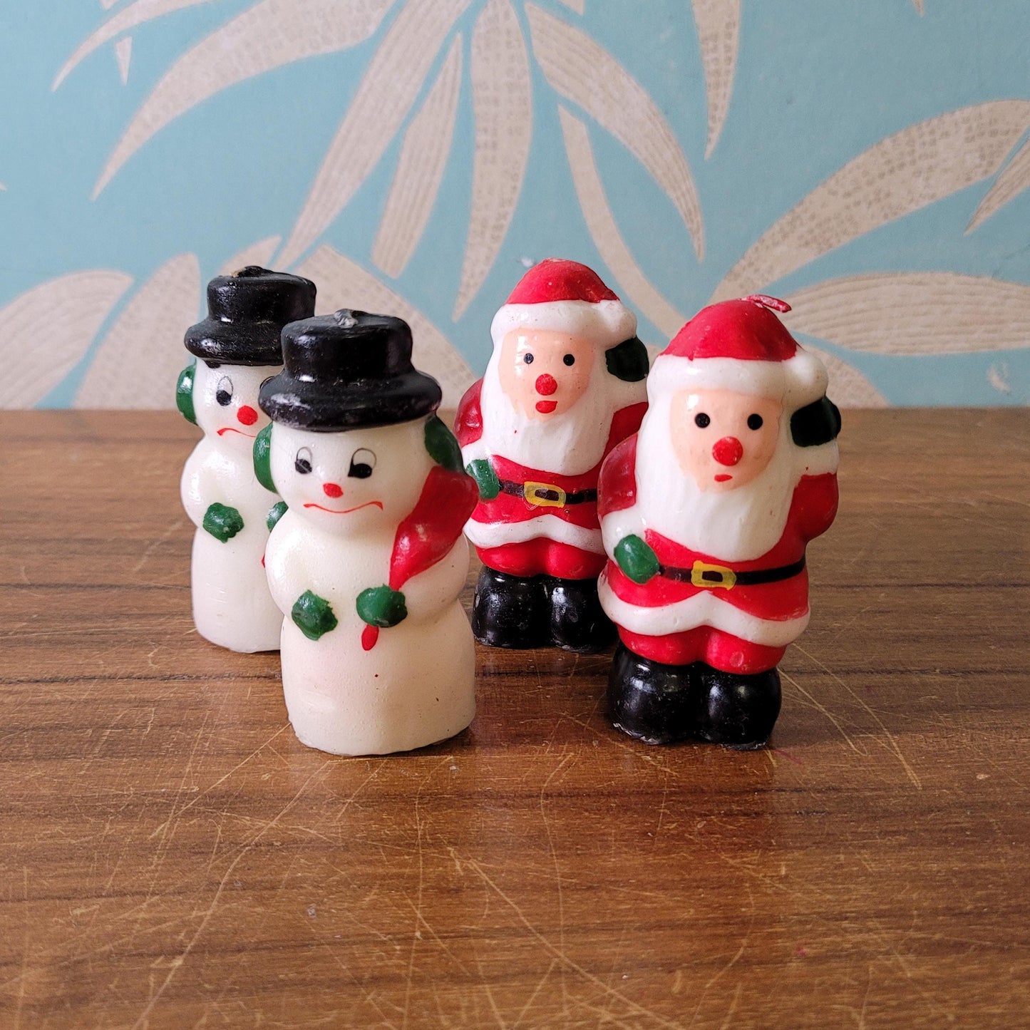 Four vintage novelty Santa, & Snowman miniature candles