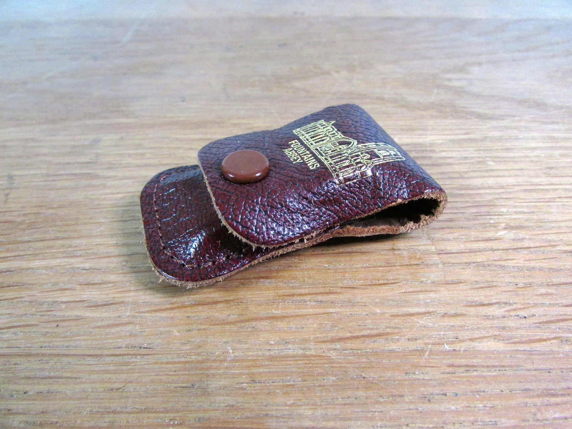 Vintage sewing tape measure in souvenir "Fountains Abbey" leather pouch