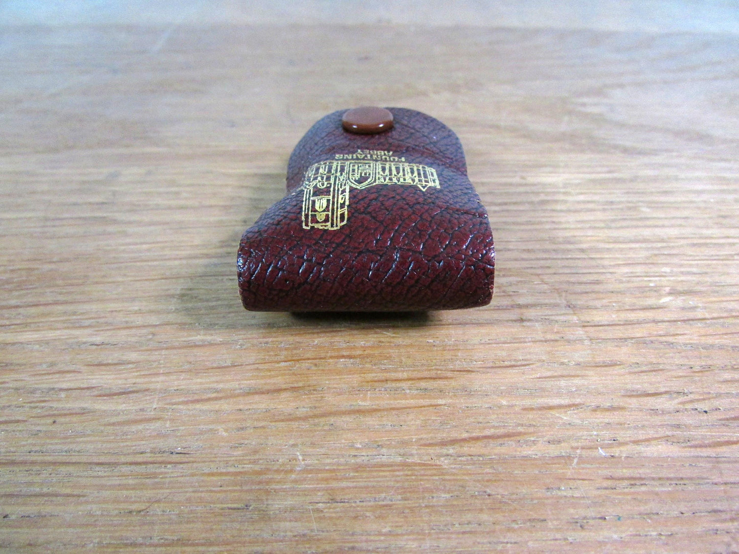 Vintage sewing tape measure in souvenir "Fountains Abbey" leather pouch