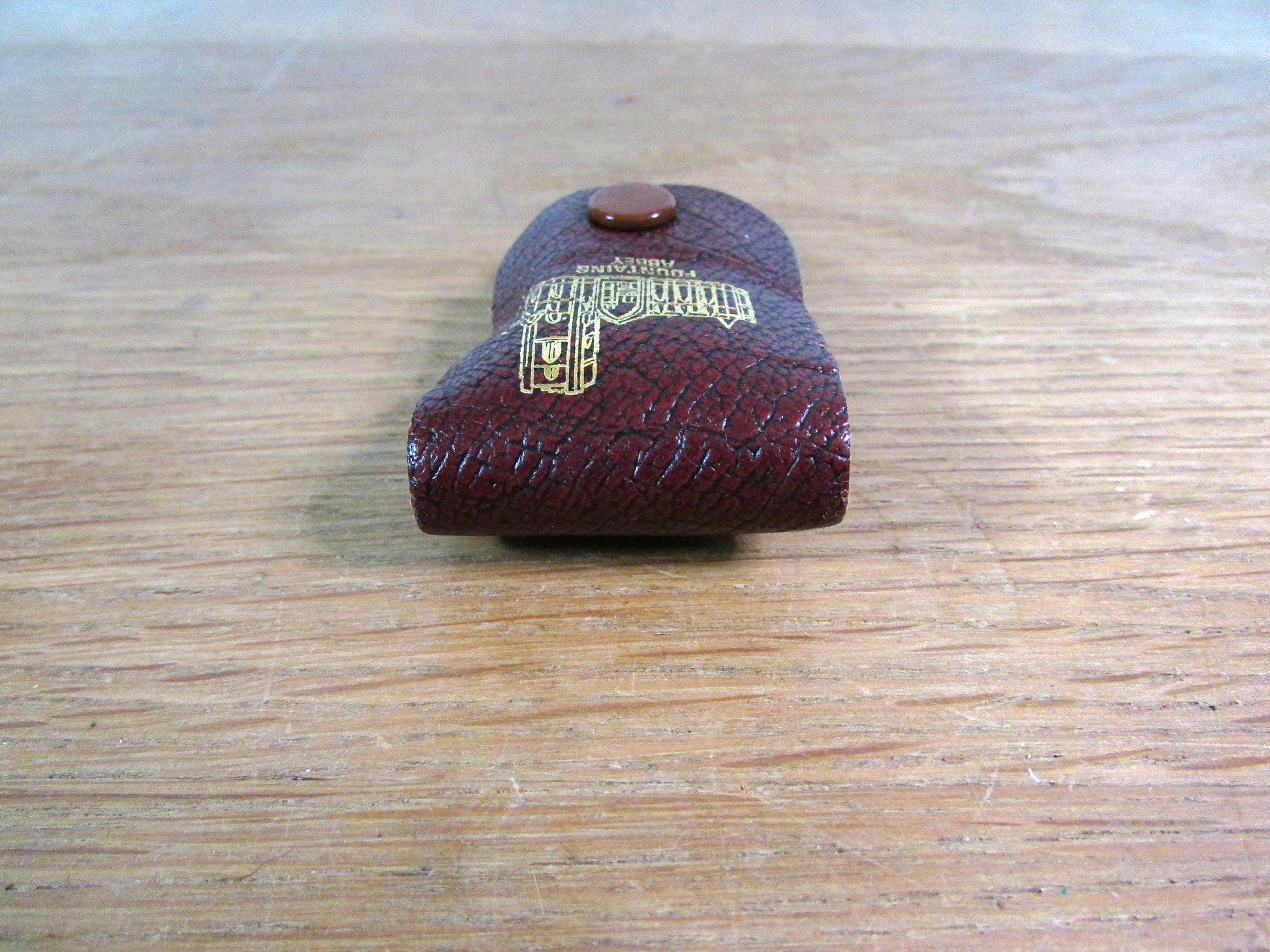 Vintage sewing tape measure in souvenir "Fountains Abbey" leather pouch