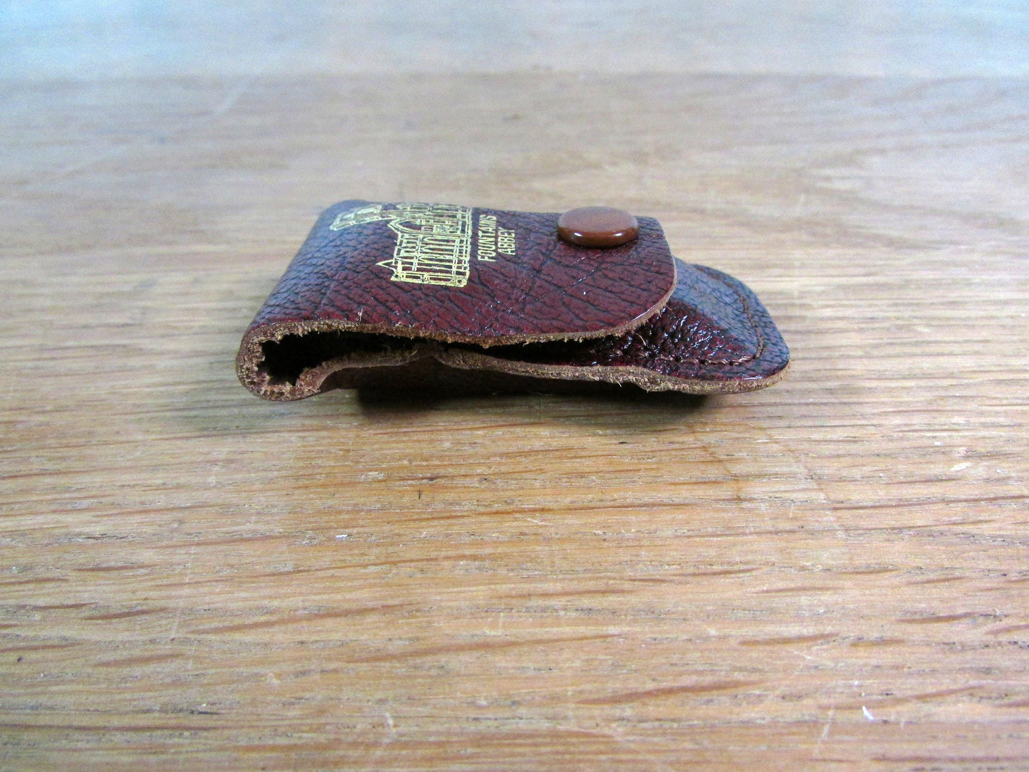 Vintage sewing tape measure in souvenir "Fountains Abbey" leather pouch