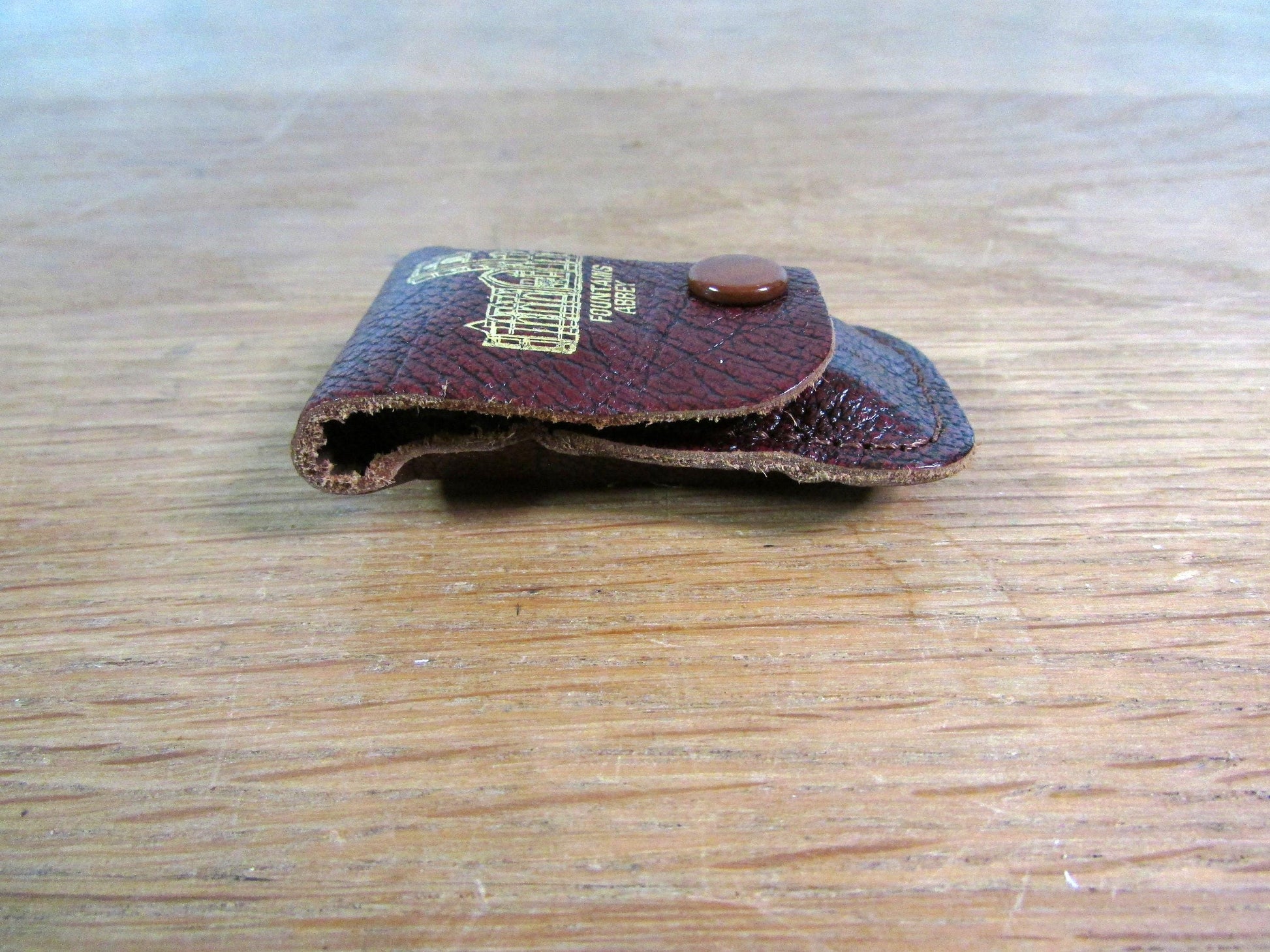 Vintage sewing tape measure in souvenir "Fountains Abbey" leather pouch