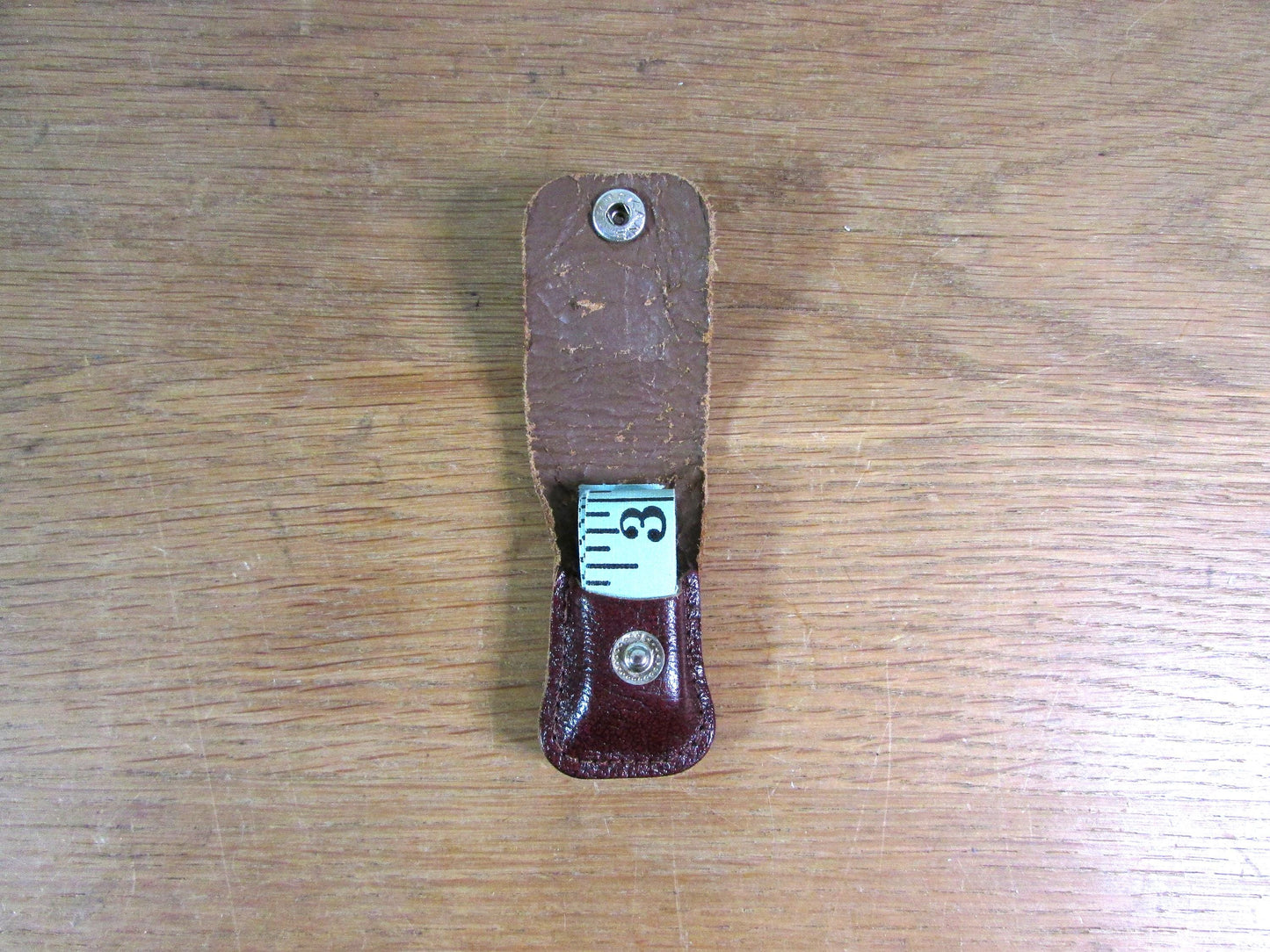 Vintage sewing tape measure in souvenir "Fountains Abbey" leather pouch