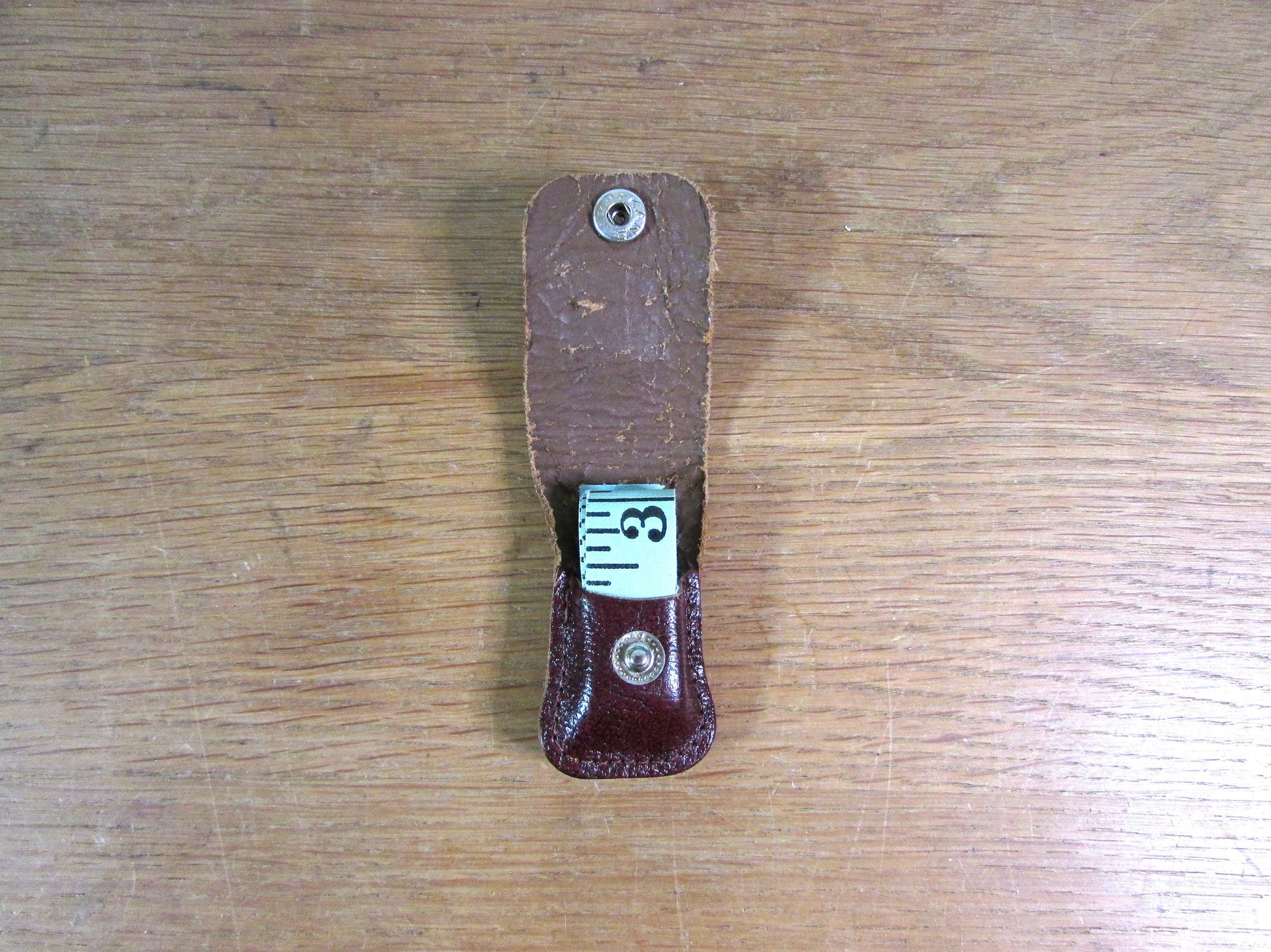 Vintage sewing tape measure in souvenir "Fountains Abbey" leather pouch