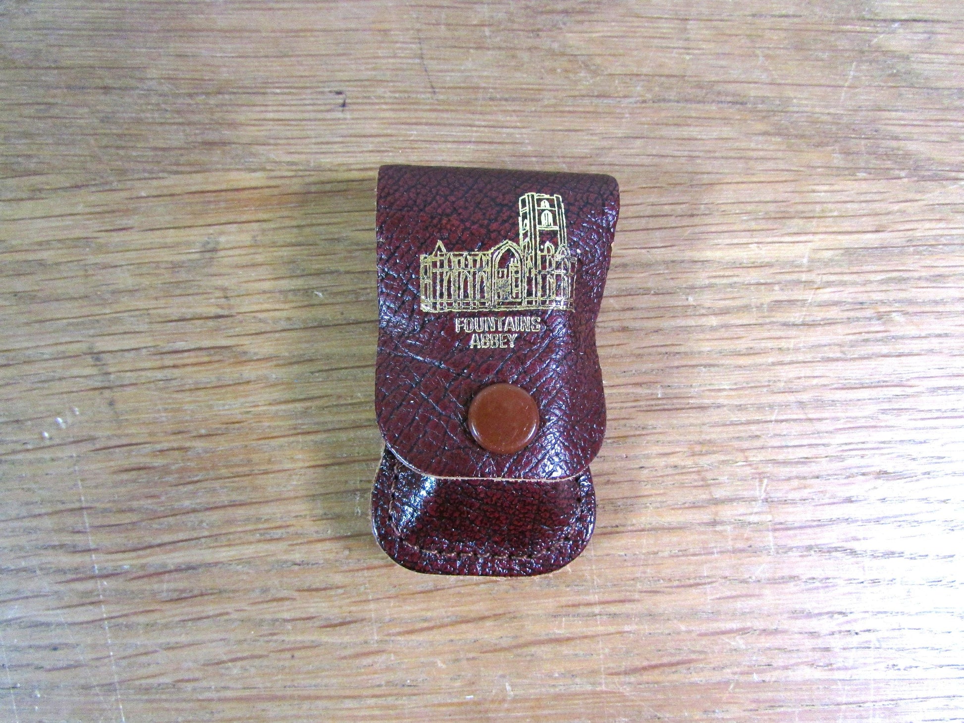Vintage sewing tape measure in souvenir "Fountains Abbey" leather pouch