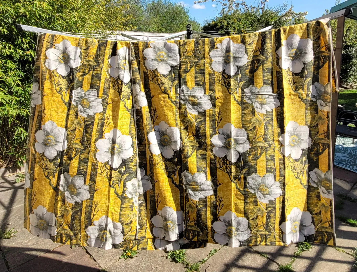 Pair of 1970s white flowers on yellow & black barkcloth curtains, 46" x 64"