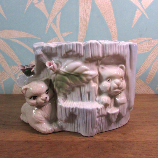 Kitsch vintage hiding kittens and log planter