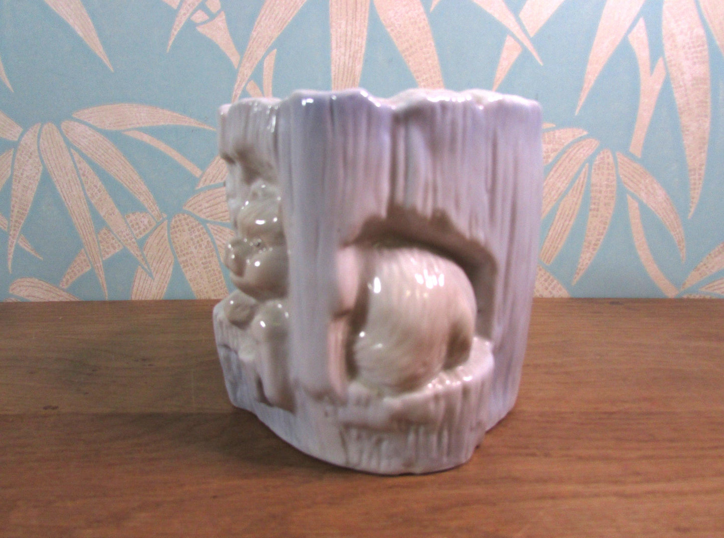 Kitsch vintage hiding kittens and log planter