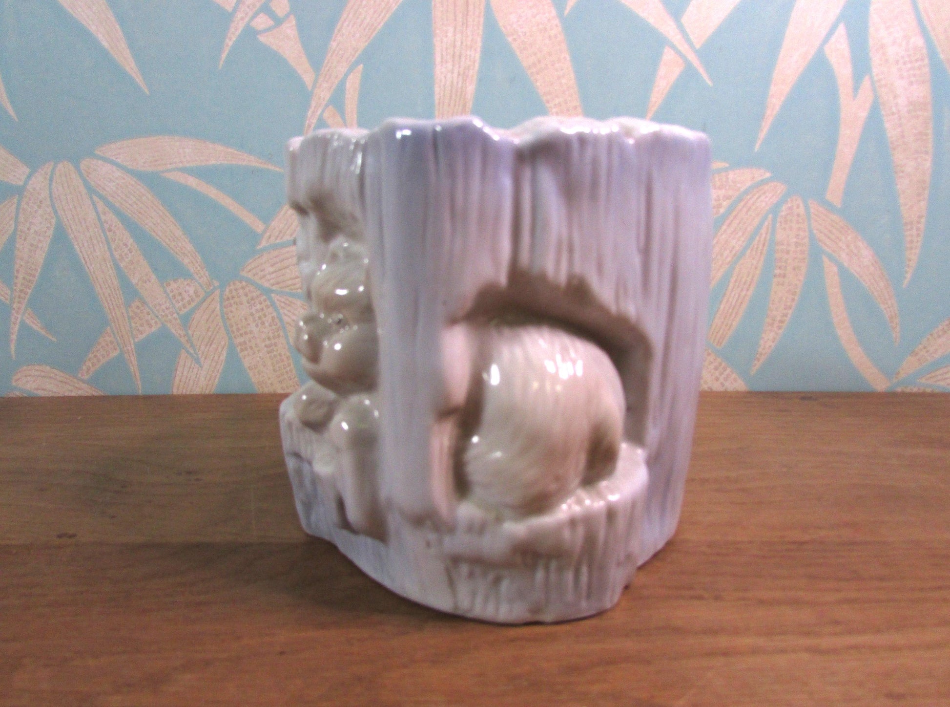 Kitsch vintage hiding kittens and log planter