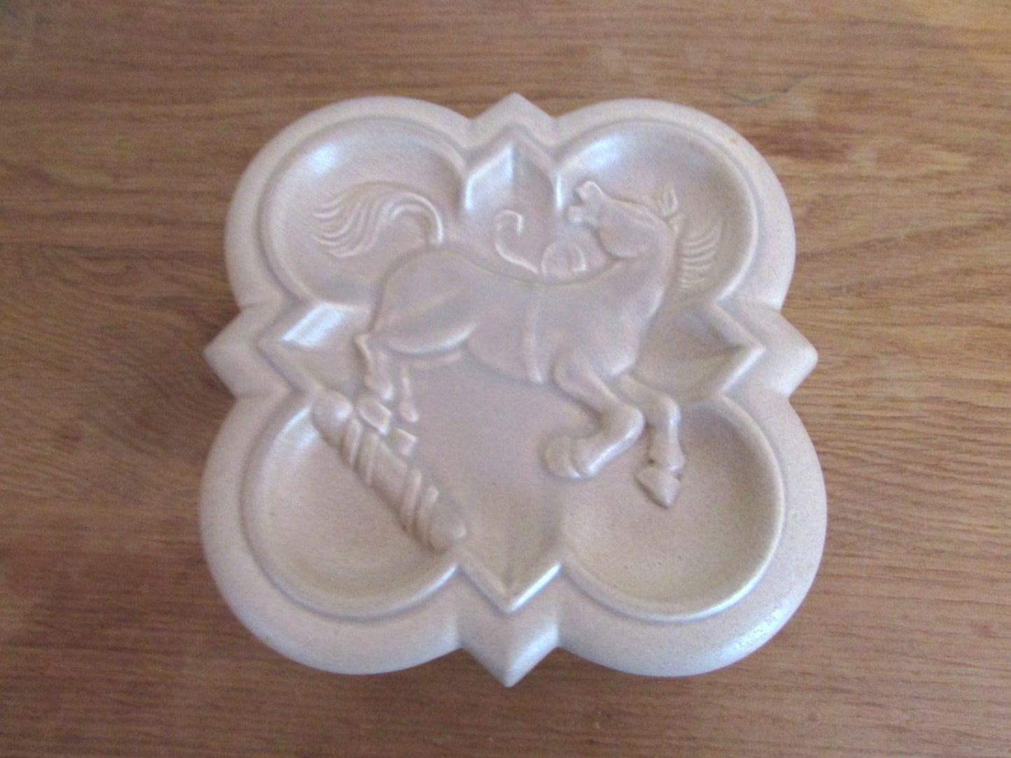 Distinctive Art Deco London Pottery embossed ceramic lidded box featuring a rearing horse/stallion motif