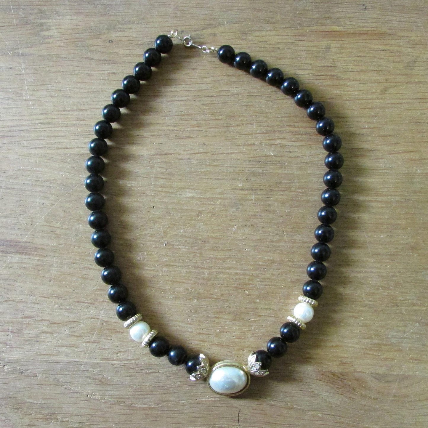 1980s Avon plastic black bead & faux pearl necklace with unusual gold-tone findings