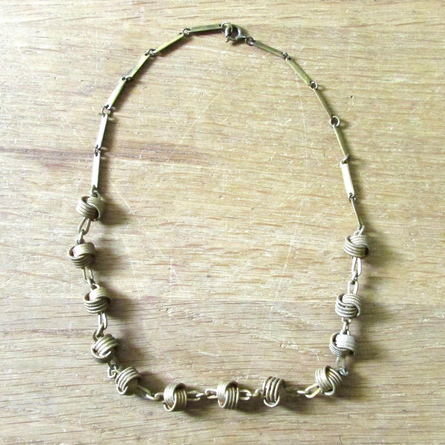 1970s brass-tone love knot & chain link necklace