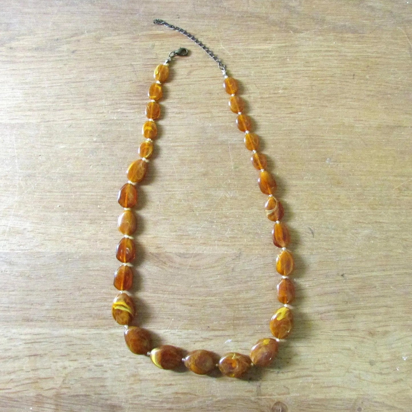 1960s amber effect marbled resin graduated oval bead necklace