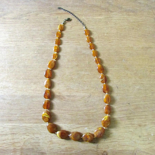 1960s amber effect marbled resin graduated oval bead necklace