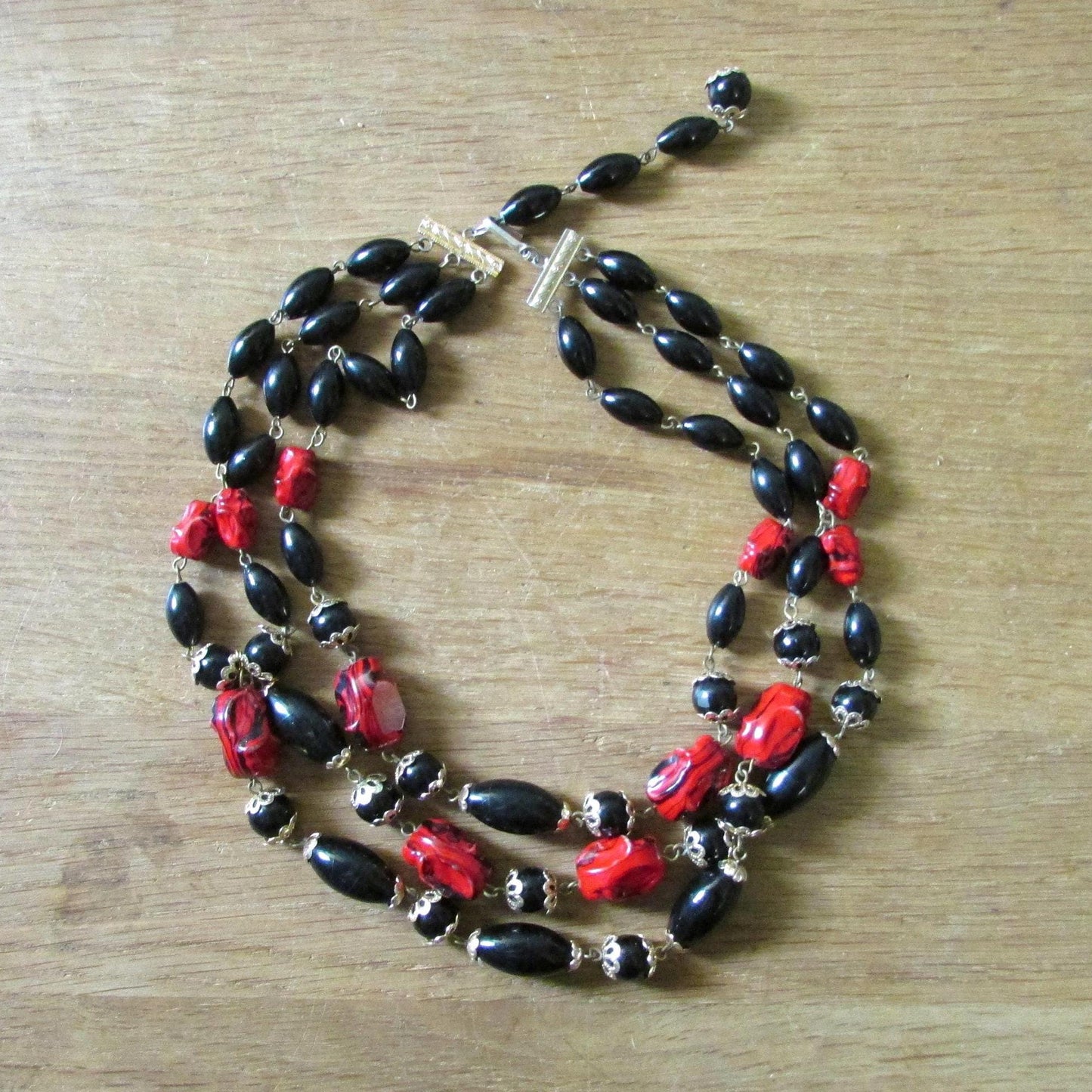 1960s red & black triple strand plastic bead necklace
