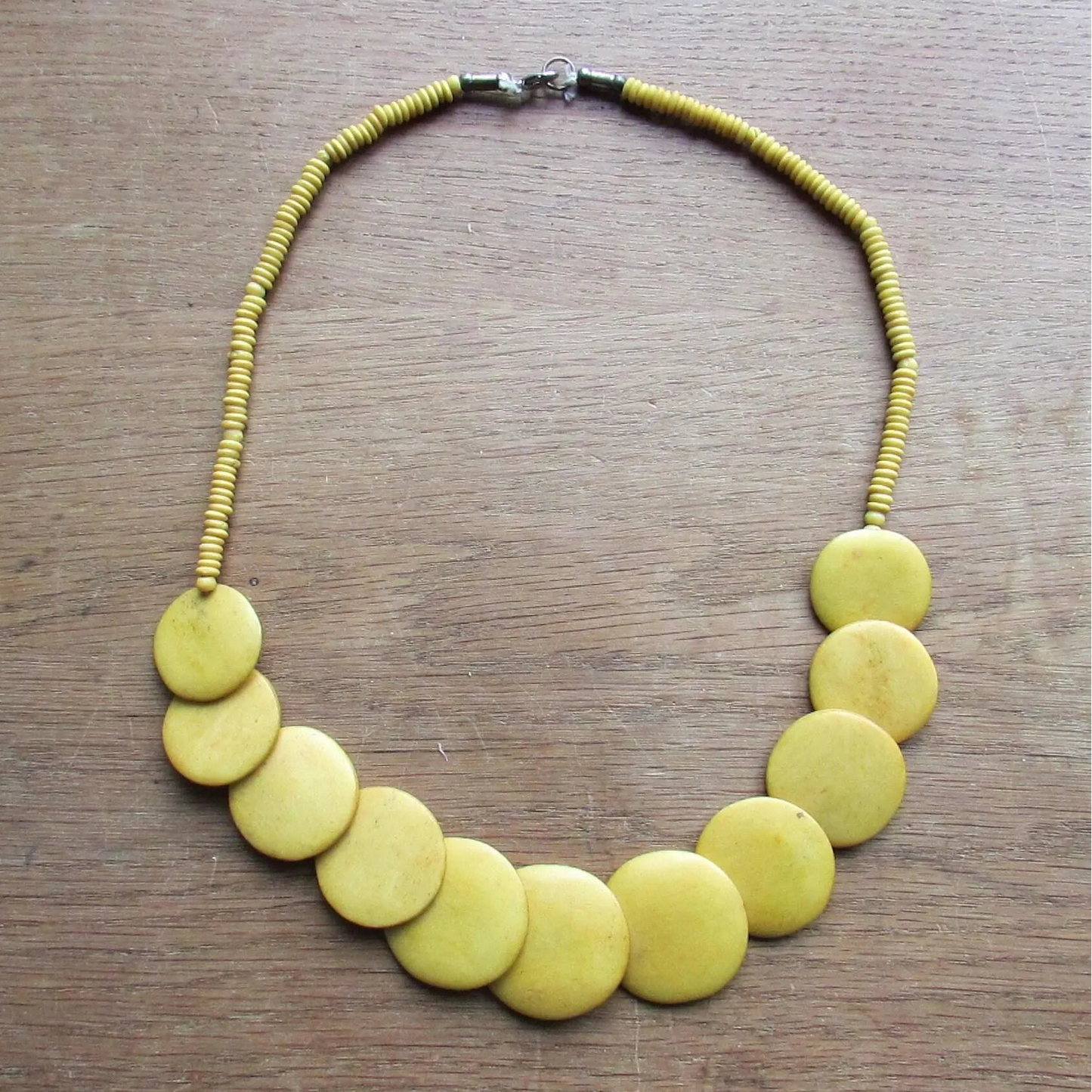 1970s yellow/mustard graduating flat disc Tagua nut necklace