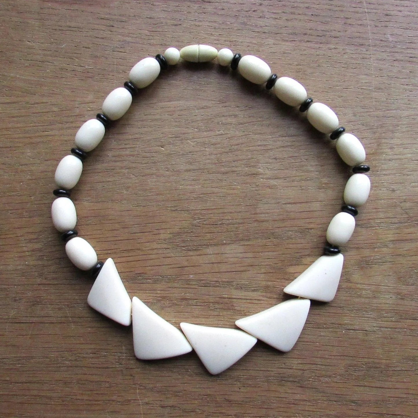 1960s white plastic geometric triangular bead necklace with black spacer beads