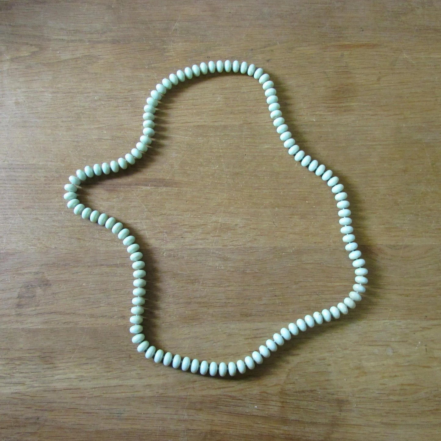 1960s pale green plastic donut bead long necklace