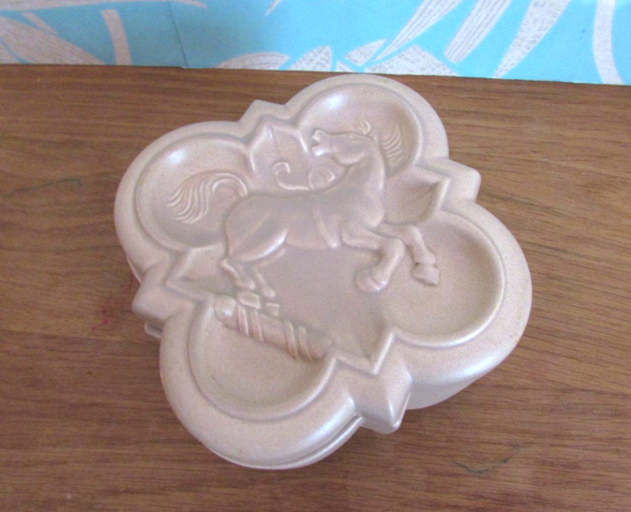 Distinctive Art Deco London Pottery embossed ceramic lidded box featuring a rearing horse/stallion motif