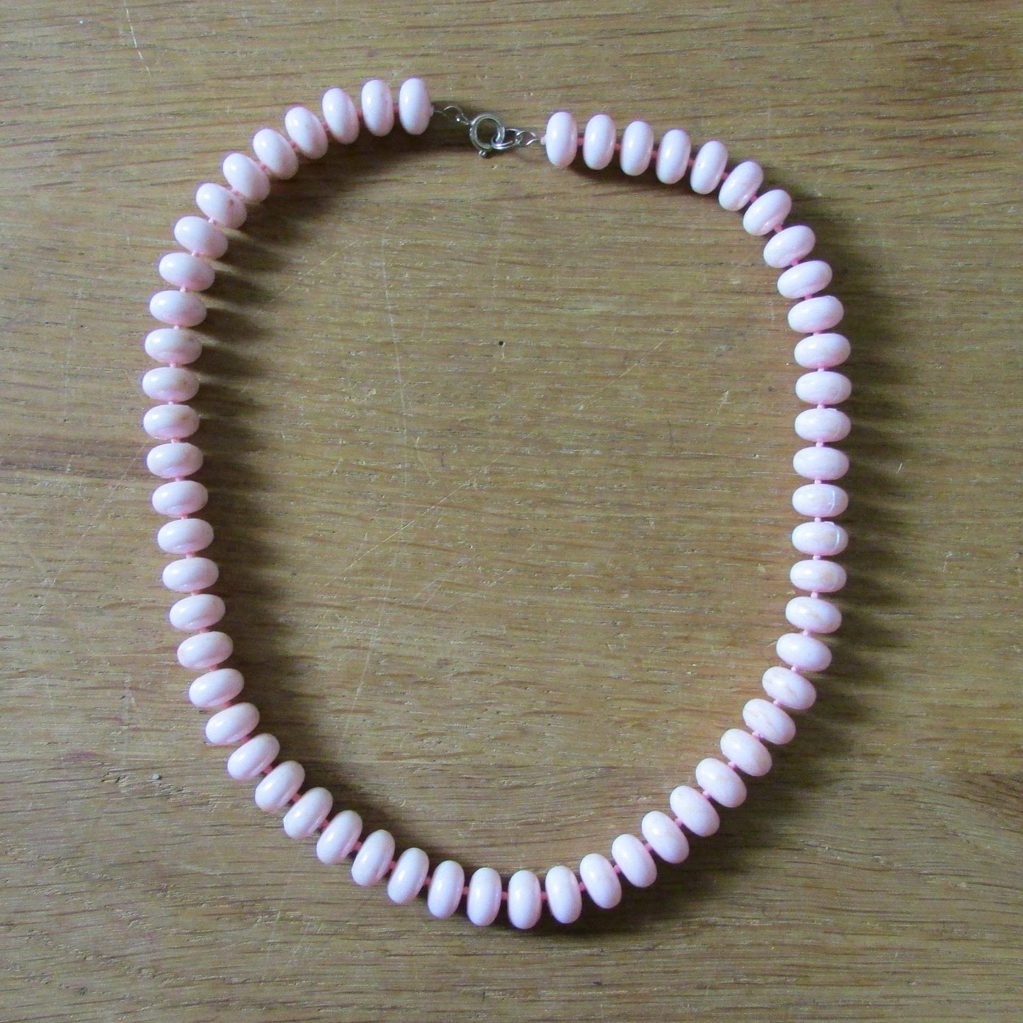 1960s soft pink plastic doughnut bead collar length necklace