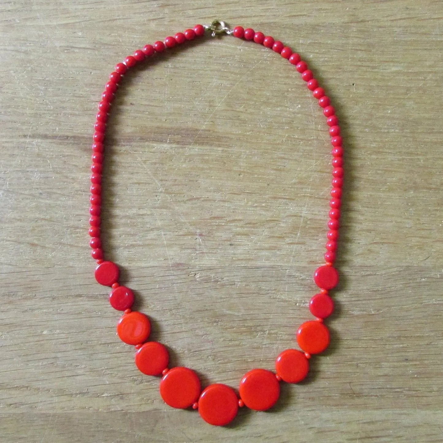 1960s cherry red flat graduating glass disc bead necklace